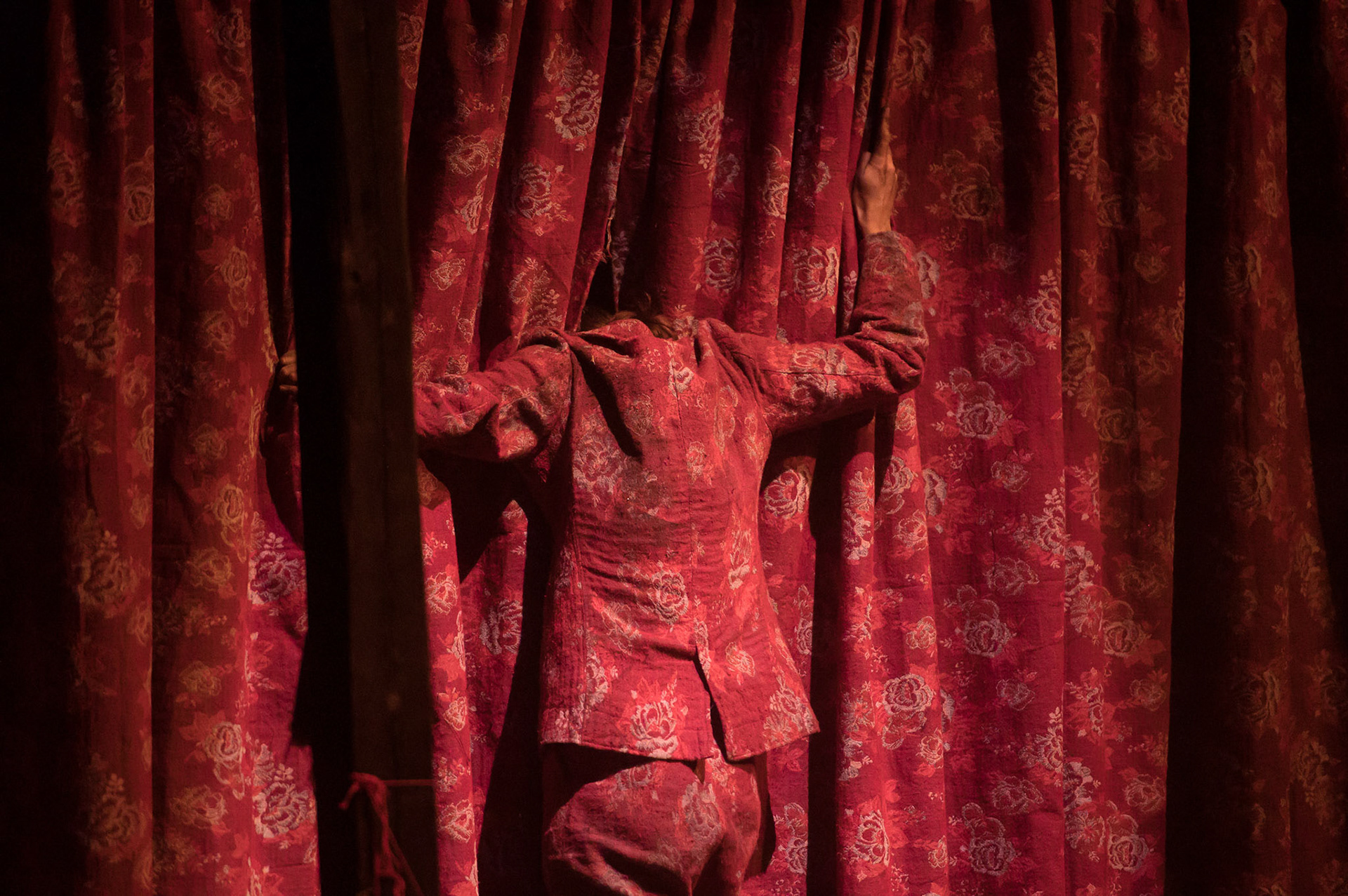 photo from the theatre show "My Cuntry" by CuntsCollective which played at The Royal Theatre in Copenhagen at Det Frie Felts Festival 2019. Karoline Clasen Holland is in the image in a costume tailored by designer Harald Lunde Helgesen of HAIK