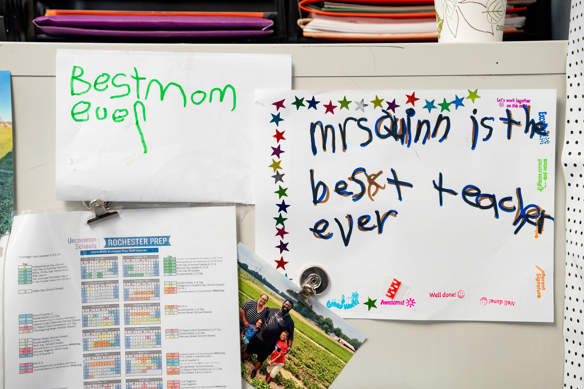 Papers are attached to a file cabinet next to the desk of Amber Pollox-Quinn, Sept. 25, 2024, on the campus of Uncommon Schools Rochester Prep Chili Campus Middle School in Rochester, N.Y. Lisa Krempa, senior director of student support services at Uncommon Schools, describes Pollox-Quinn’s special education work as “incredible.”