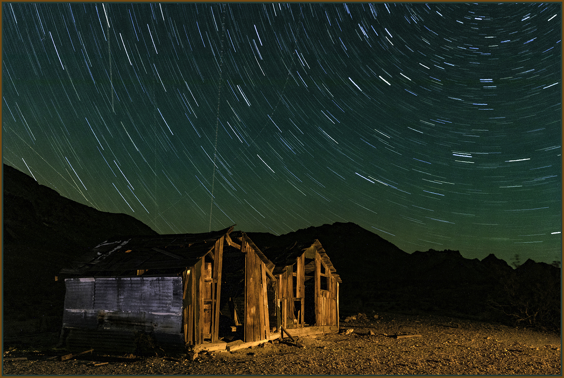 Star trails over abandoned cabins near Rhyolite, Nevada