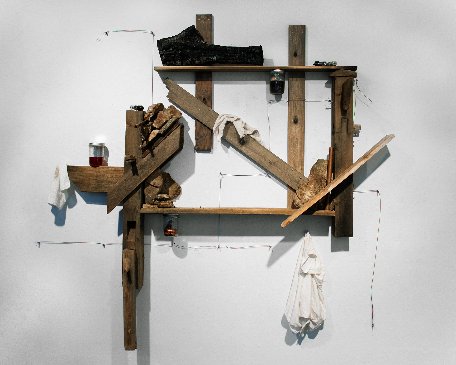 Basement, 2025. wood, stone, wire, found materials