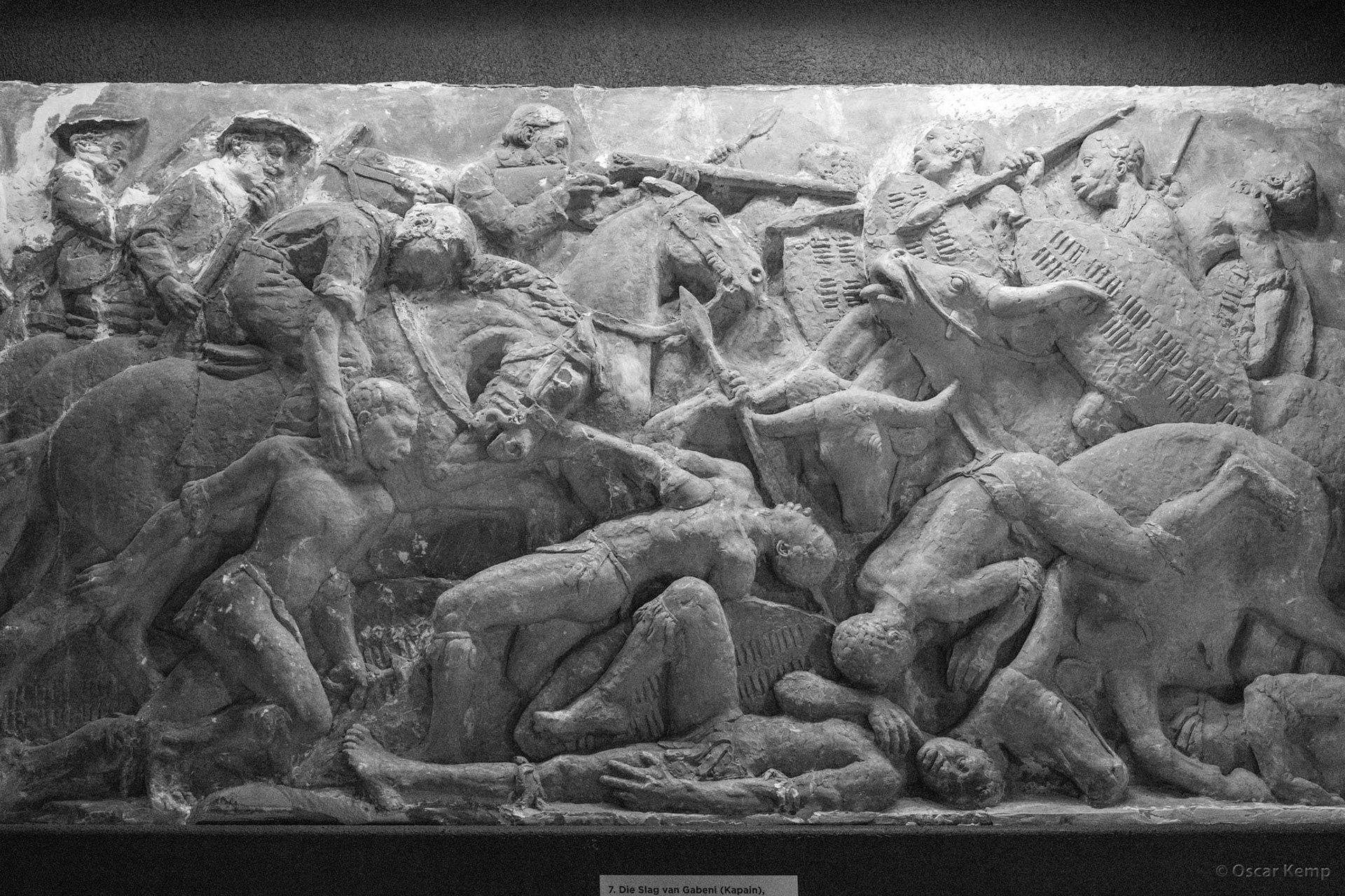 Voortrekkersmonument, Pretoria / No. 7 of 27 marble panels (frieze) in the Heldensaal; the bloody battle of Gabeni: Voortrekkers on horseback against the Zulus on oxen [South Africa, 2026 01]