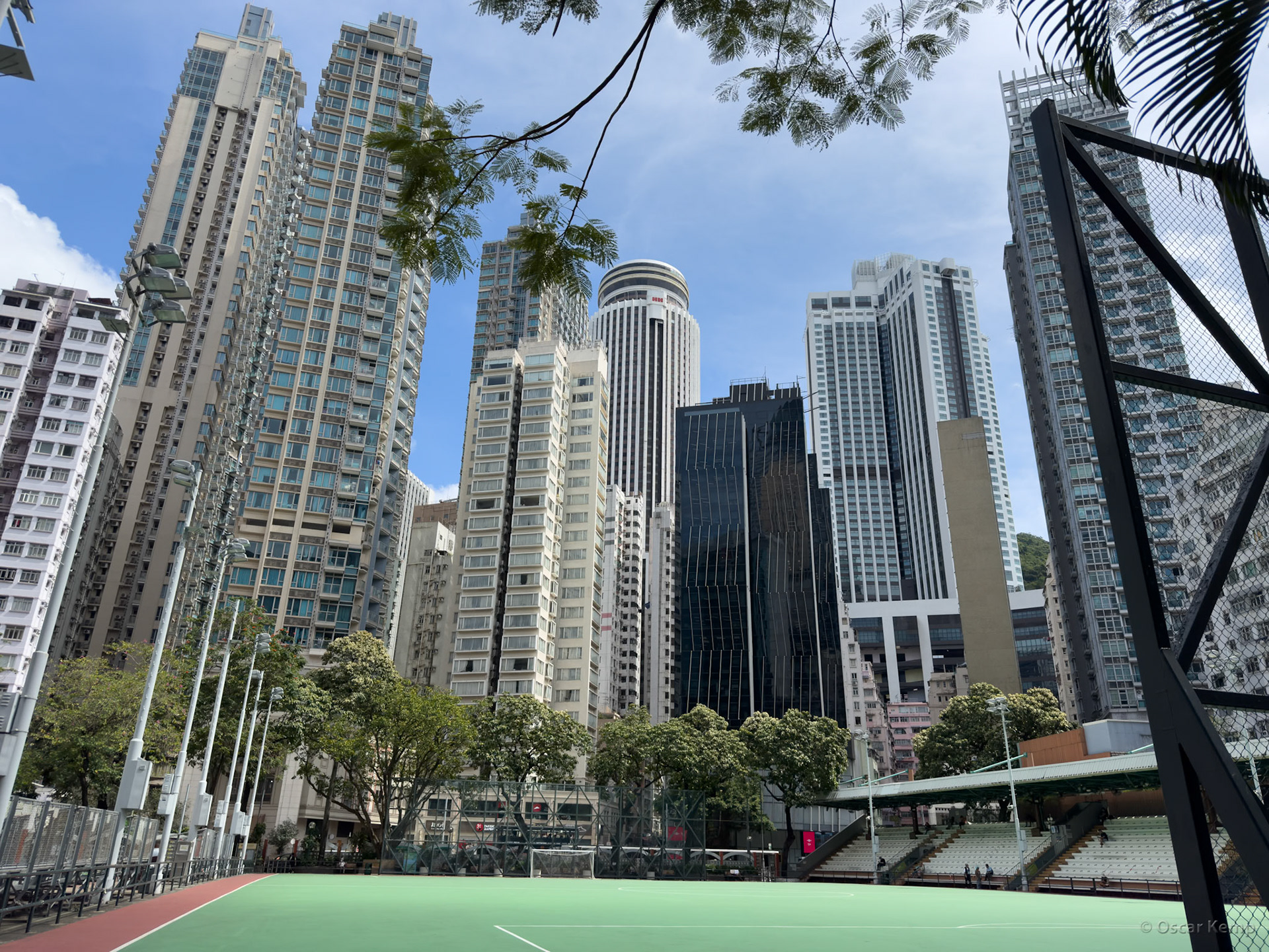 Hennessy Road / Southorn Stadium in the foreground and behind it the Hopewell Centre surrounded by high-rise residential towers [China, 2025 05]