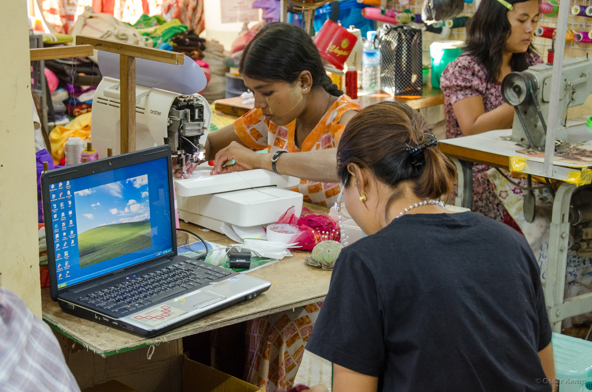 Bogyoke Aung San Rd / Seamstresses using modern tools [Myanmar, 2012 01]