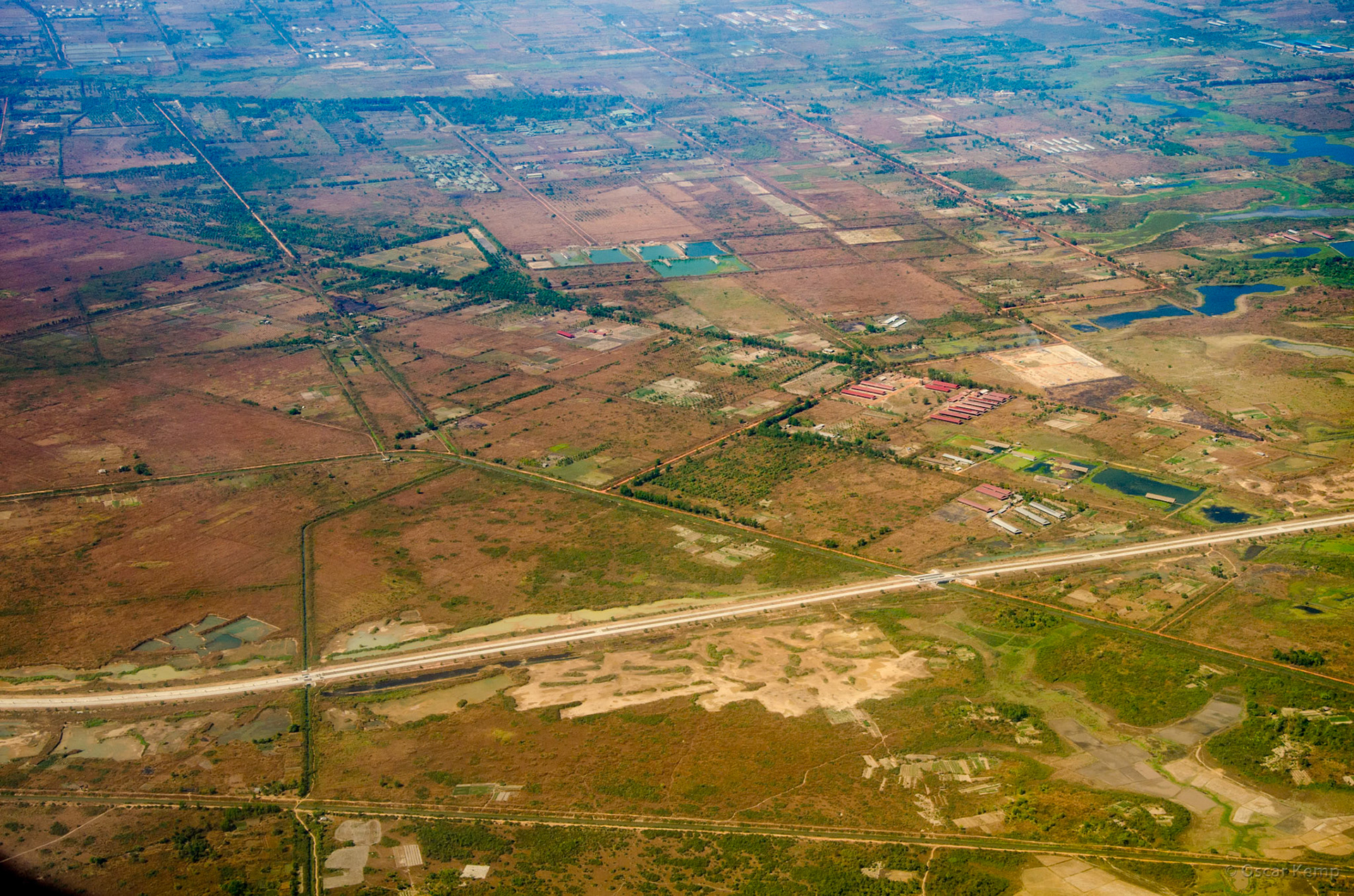 Hlegu / Aerial shot with agricultural lands and Yangon-Mandaly Hwy in the foreground