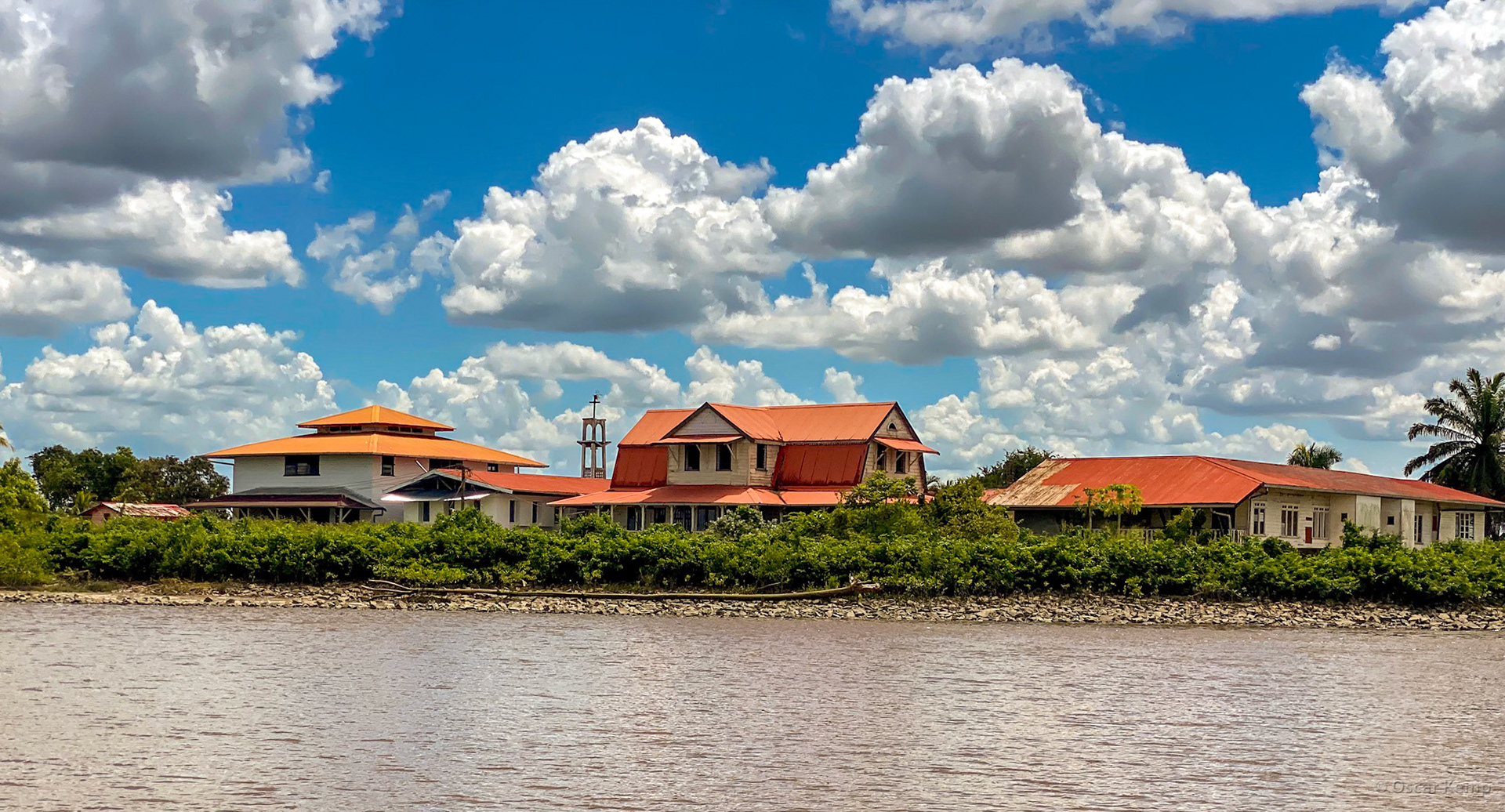 Plantage Alkmaar / Children's home Sukh-Dhaam with Djagat Kie Djotie EBGS church tower in the background near Alkmaar Cemetery [Suriname, 2022 09]
