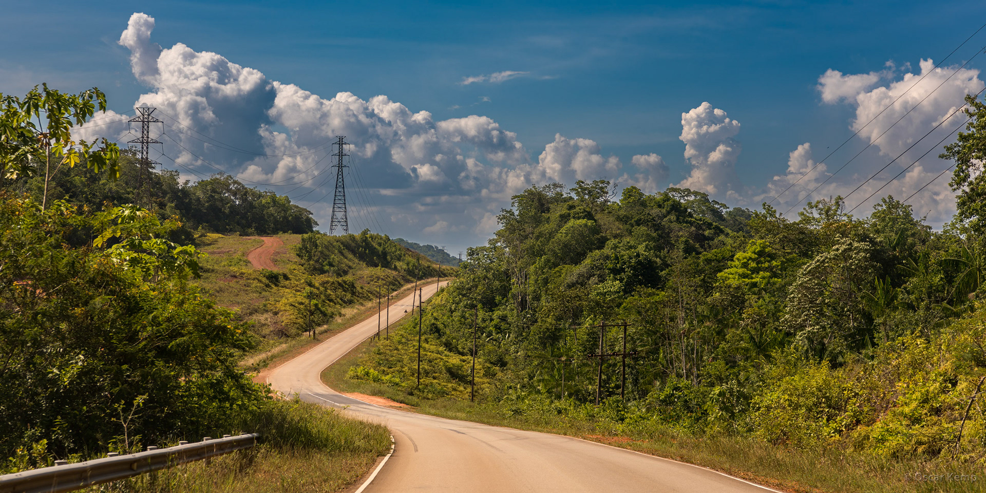 Afobaka road near Nieuw Lombé / Road to Afobaka hydroelectric power station with high-voltage pylons on the left [Suriname, 2018 10]