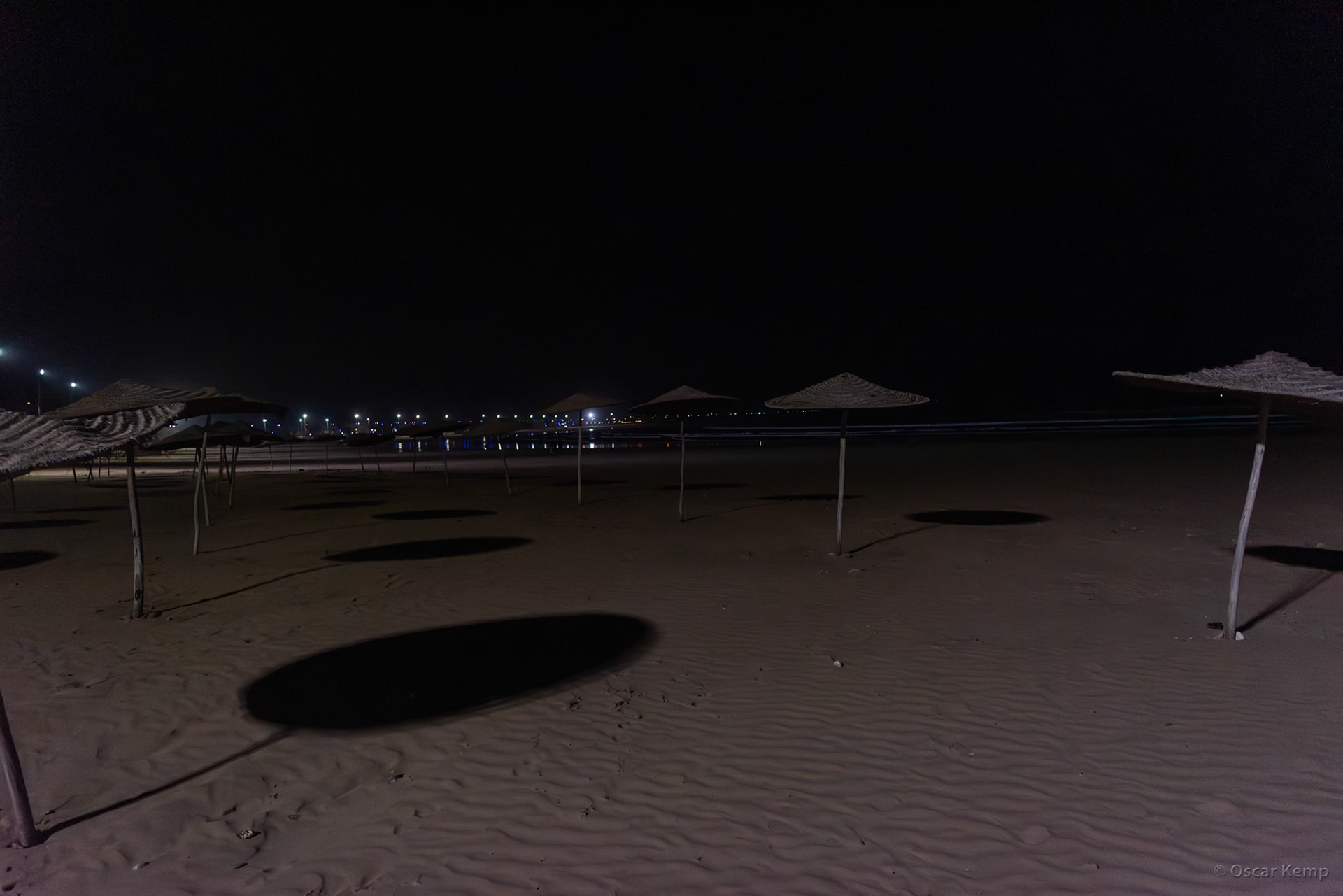 Essaouira-Av de L'Istiqlal / Lonely fixed beach umbrellas after sunset [Marocco, 2025 02]