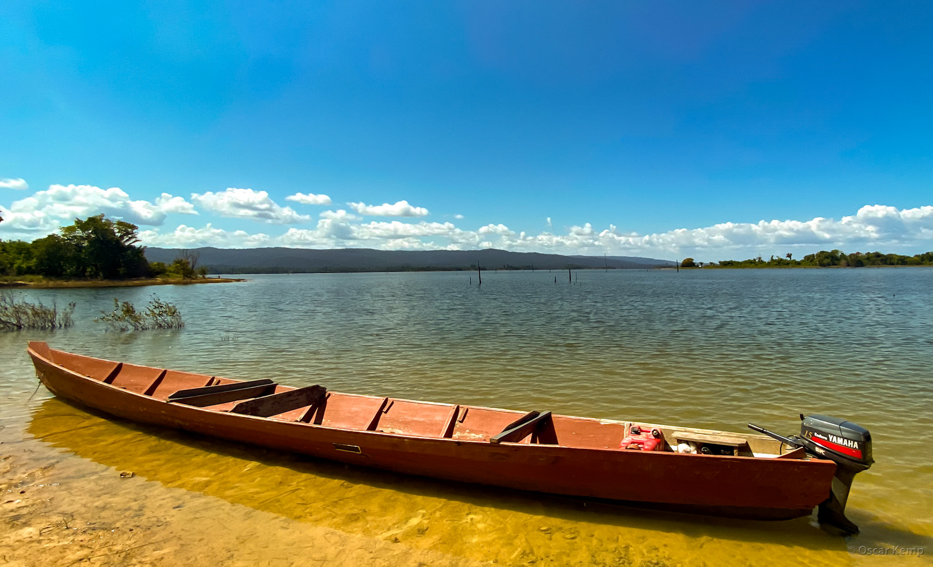 near Friends Place Island / Korjaal or dugout canoe with a powerful and reliable outboard motor: Best Practice Transport on Inland Waterways [Suriname, 2022 10]