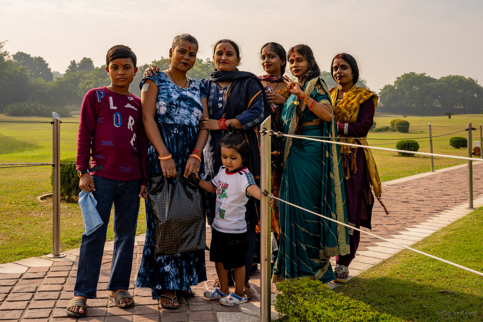 New Delhi-Sant Nagar / Happy and colorful traditional dressed visitors at the entrance of the Lotus Temple [India 2025 11]