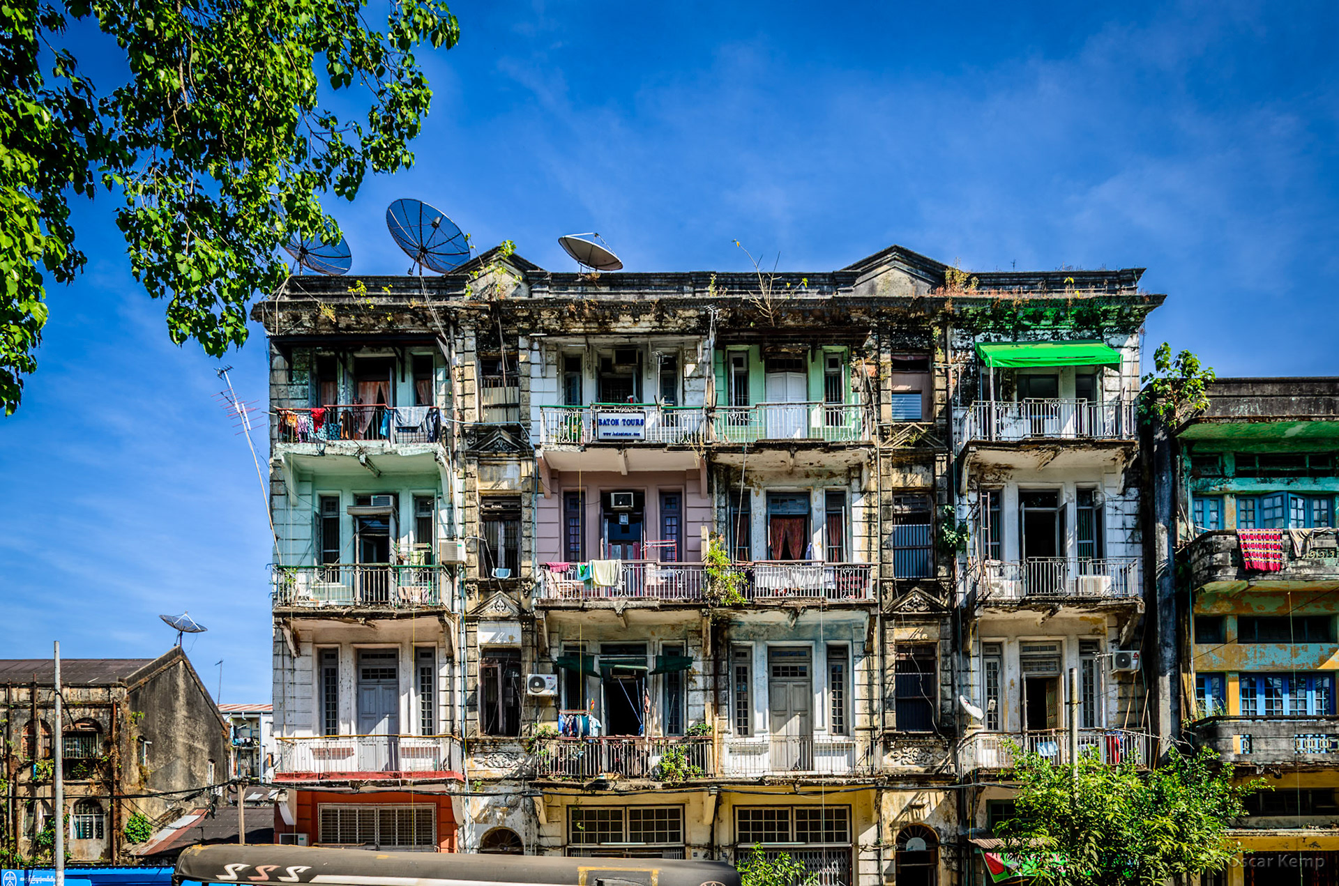 Bo Aung Kyaw St / Residential building with different levels of maintenance and satellite dishes on the roof [Myanmar, 2012 01]