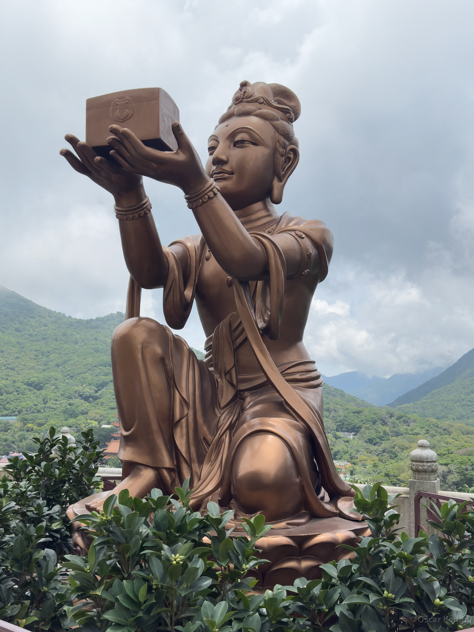Ngong Ping / One of the smaller bronze images known as "The Offering of the Six Devas" that are posed offering flowers, incense, lamp, ointment, fruit, and music to the Buddha [China, 2025 05]
