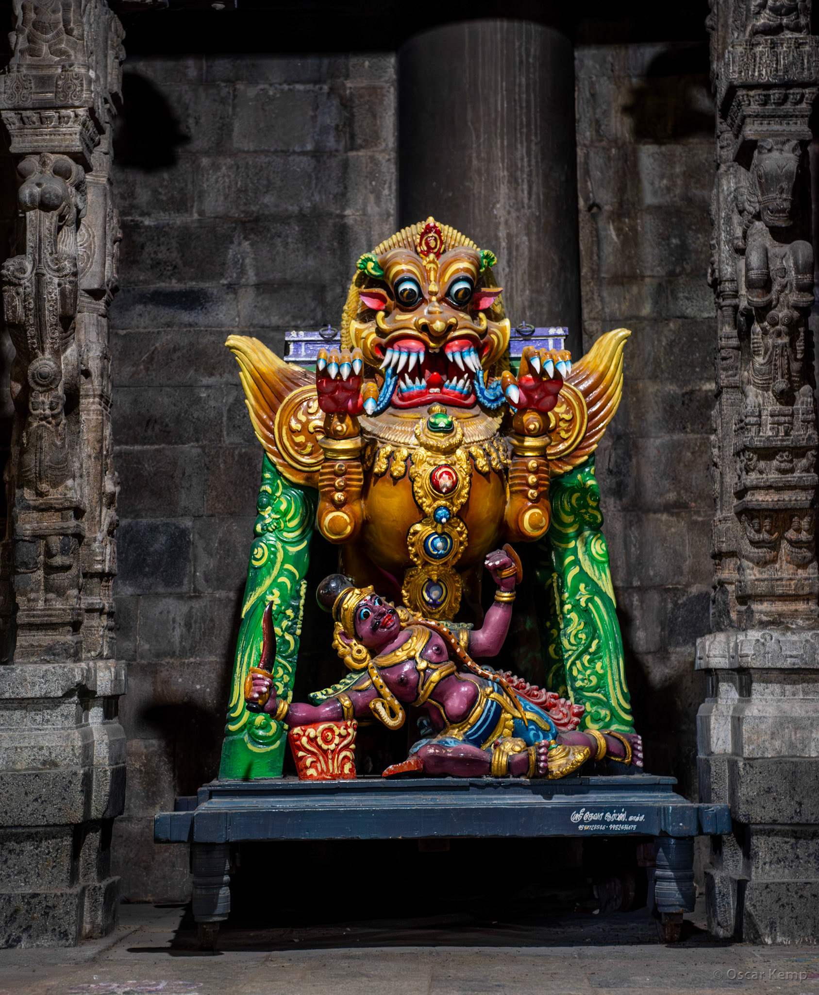 Kanchipuram / Colorful wooden statue in the Ekambareswarar Shiva temple of the Hindu god Narishma (fourth incarnation of Lord Vishnu) killing the demon king Hiranyakashipu [India 2024 09]