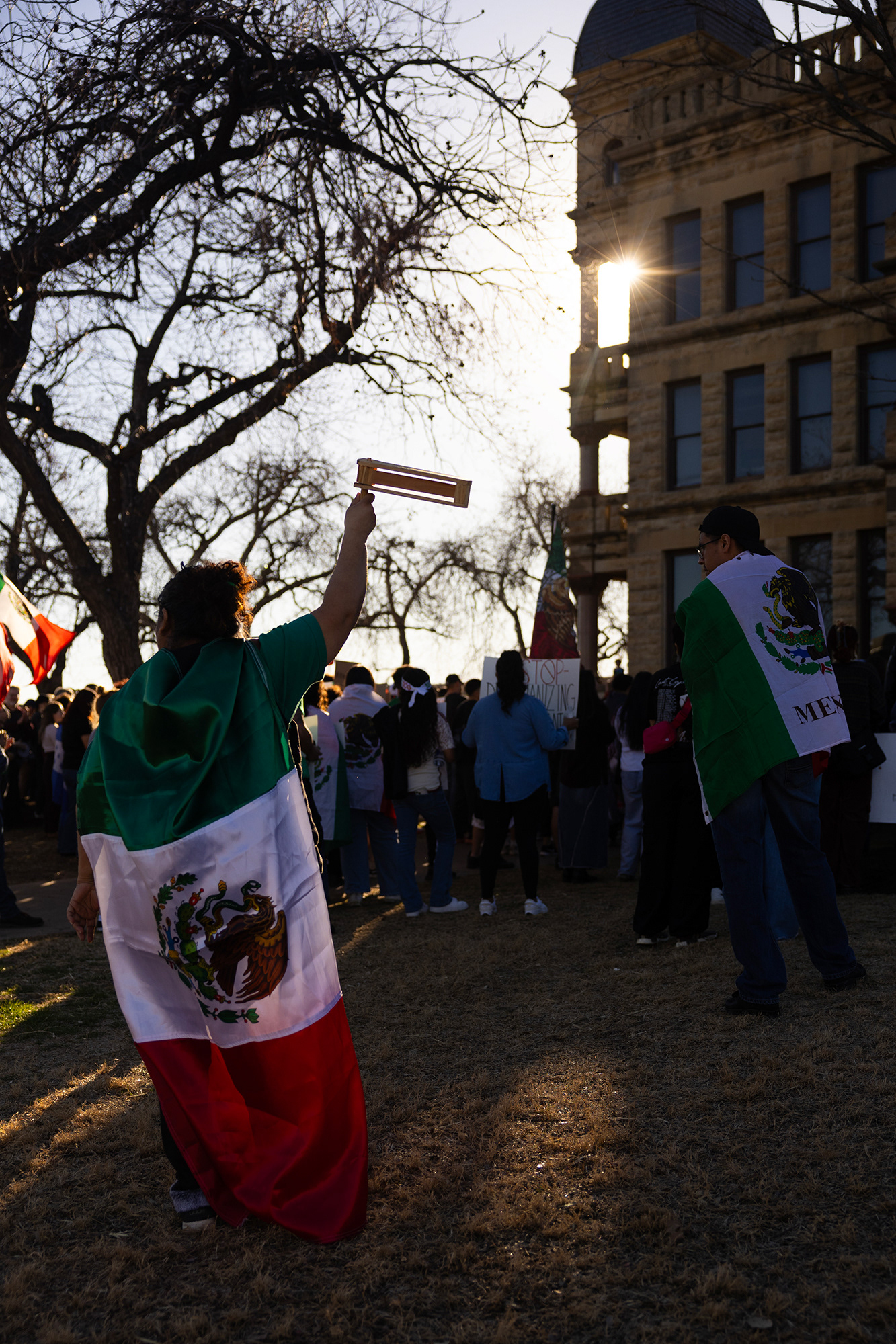 A protestor uses a mexican matraca noise-maker at the anti-ICE and mass deportations protest that took place on Feb. 1 in Denton's downtown square.  Photo by Maria Vargas