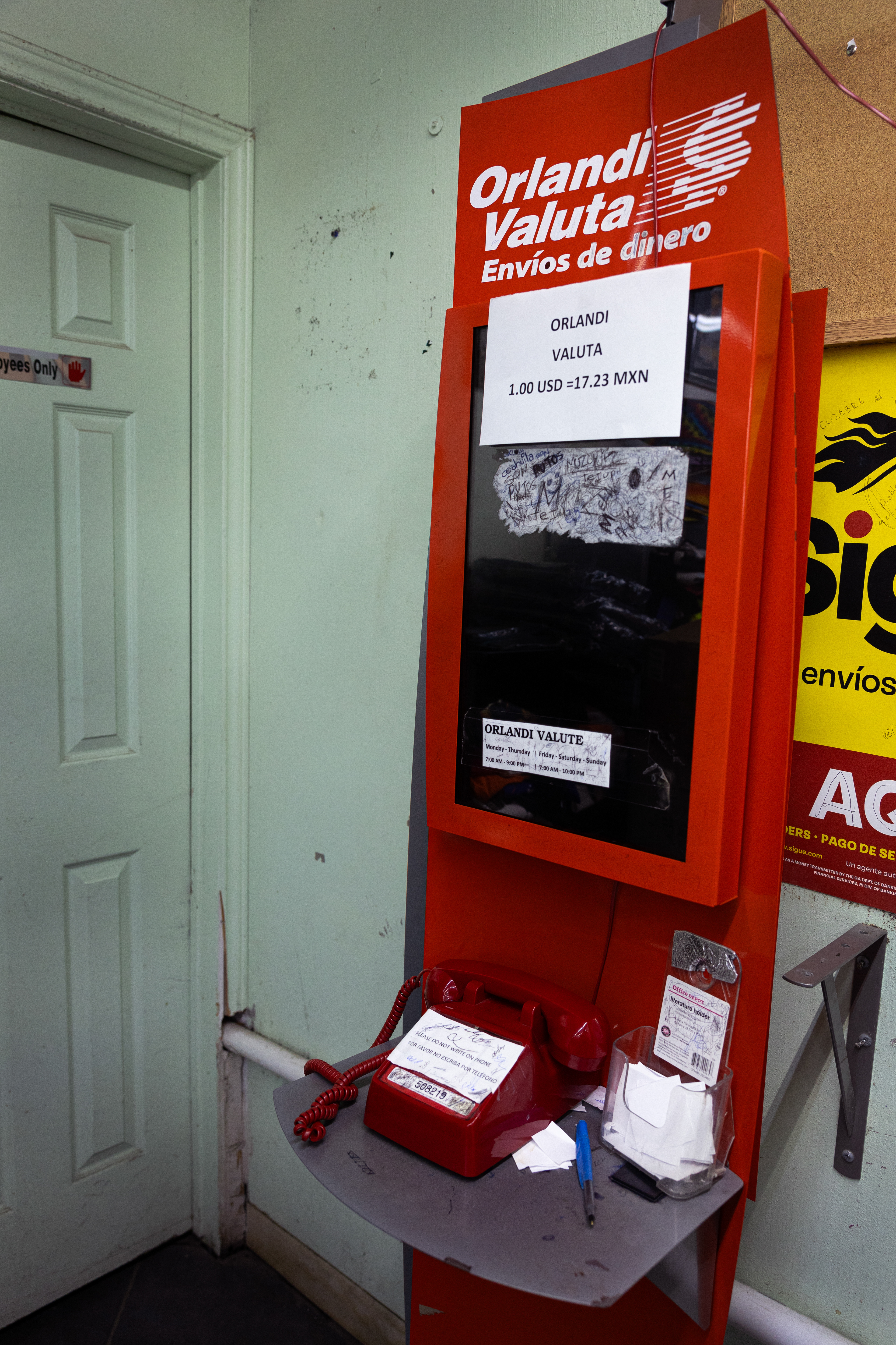 Inside a gas station off McKinney Street, an abandoned remittance machine stands quiet—a once-active link for sending money to families in Mexico, now left behind.