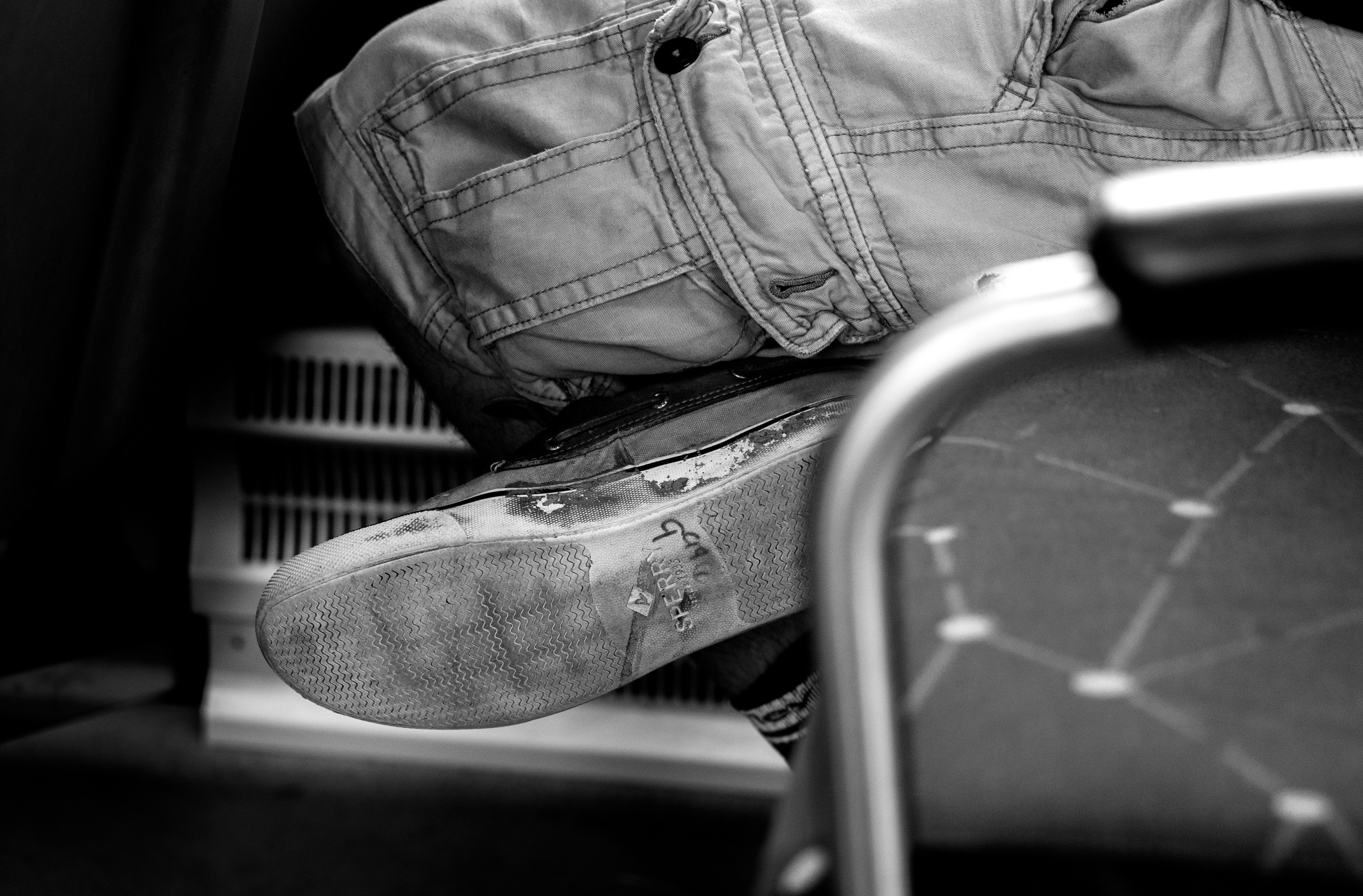 Danial Shaw’s shoe shows a $9.99 price tag, a reminder of the thrift store where it was purchased, as he rides the DCTA A-train as a part of his journey to Ft. Worth. haw, who recently totaled his car, represents a group of riders who depend on public transit not by choice, but by necessity—many of them facing financial struggles and challenging circumstances. 