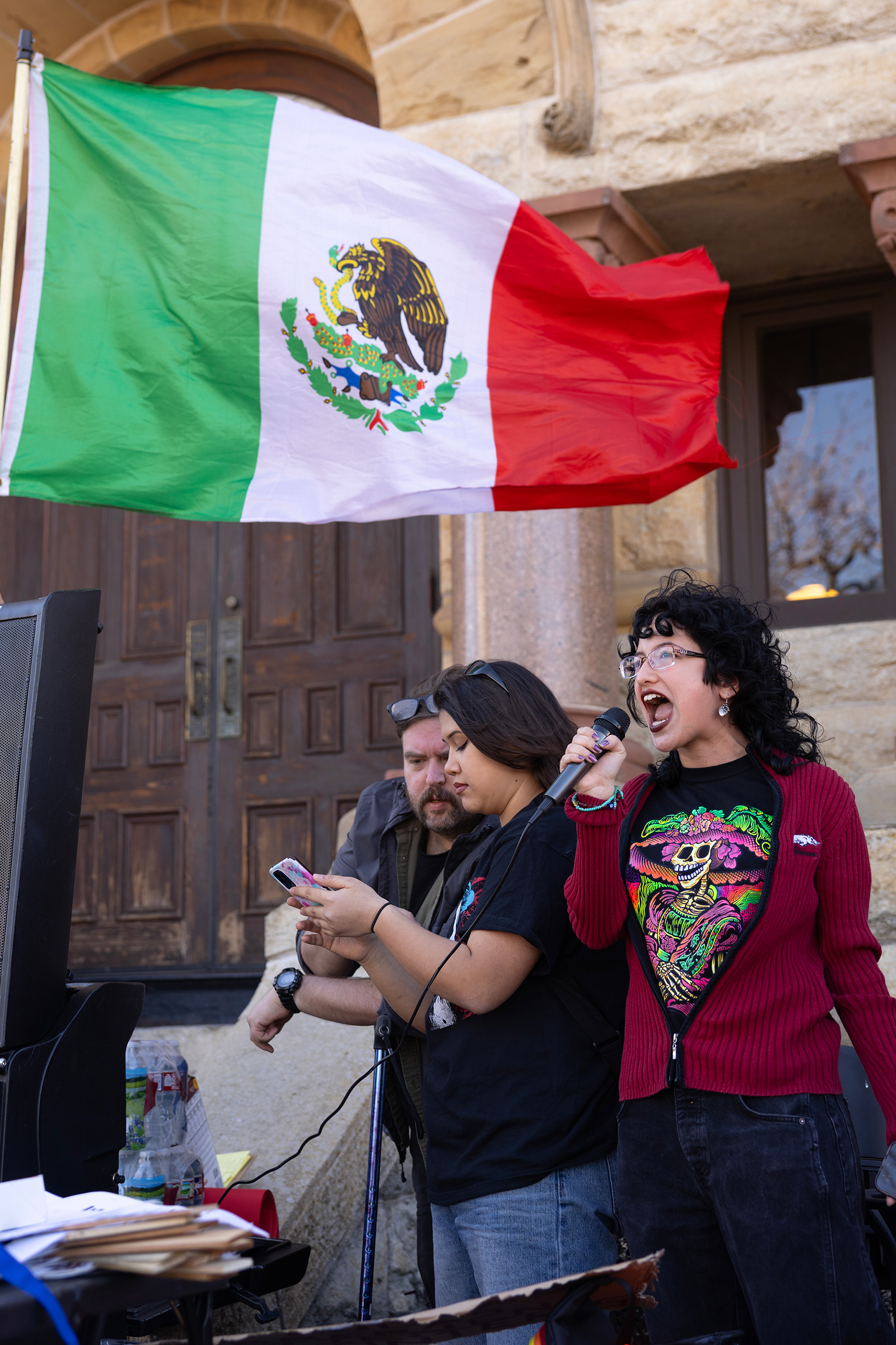 Sofía Stevens-Garcia a member of UNT’s YDSA chapter speaks about the importance of the protest and their experience as a Mexican immigrant at the anti-ICE and mass deportations protest on Feb. 1 in Denton's downtown square. Photo by Maria Vargas
