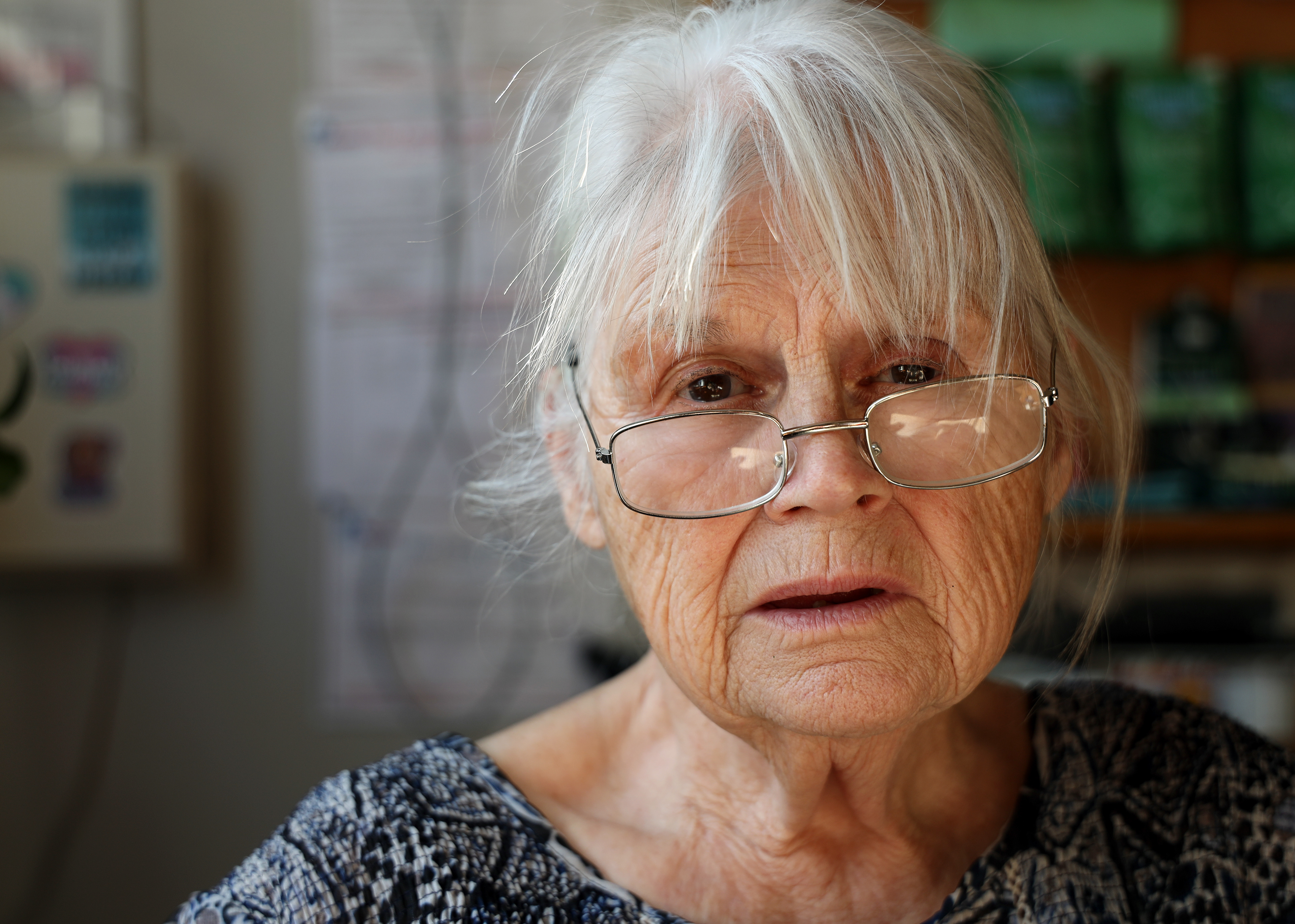 Darlene Delapaline sits beside the window of her daughter's shop, Mashup Market. UNT students will see her in the window and come in to listen to her stories and to have someone listen to theirs.