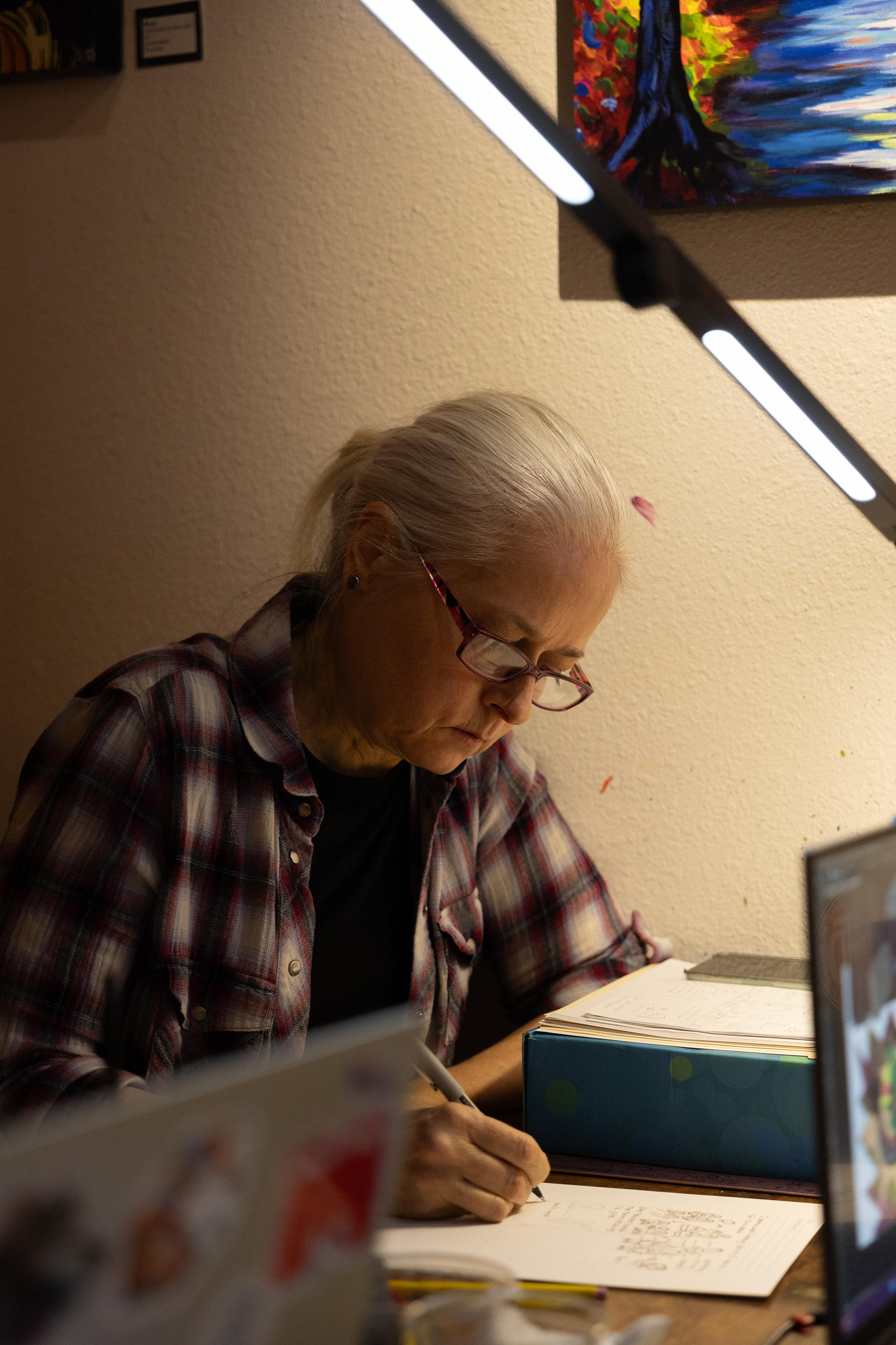 Bliss Webb works on a comic for the 3rd annual Attack the Page mini comic marathon on Feb. 22 at Bramlitt's Yellow Dog Art Bar and Gallery.