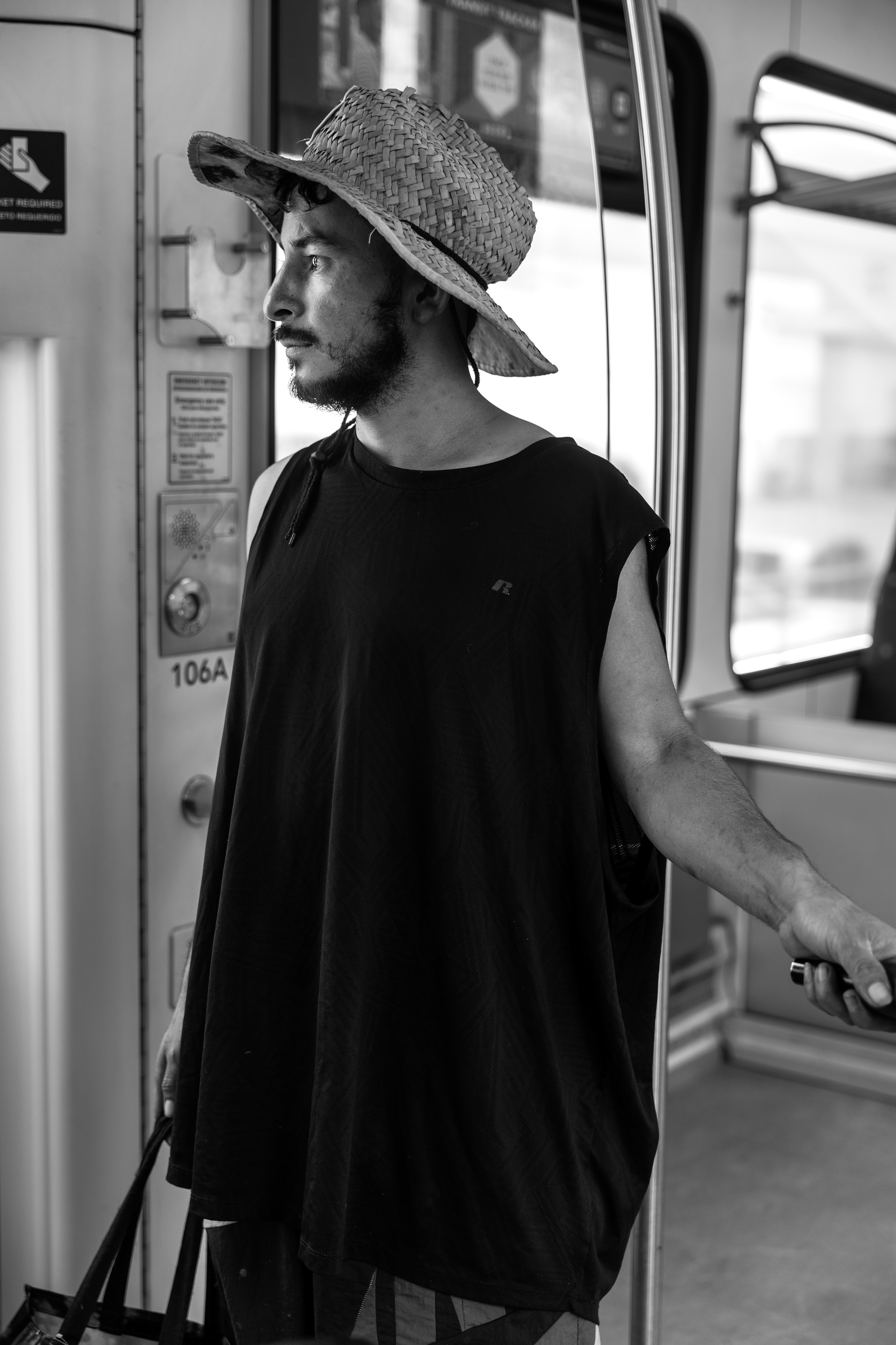 Adan Sariano rides the DCTA A-train on Monday, April 15, 2025, in Denton, Texas. Sariano, an immigrant from Mexico, relies on the train and his bicycle to get around, as he does not own a car. “The train helps me visit my family when my bike isn’t enough,” Sariano said. On this day, he was traveling to Richardson to see relatives. (Quote translated from Spanish)