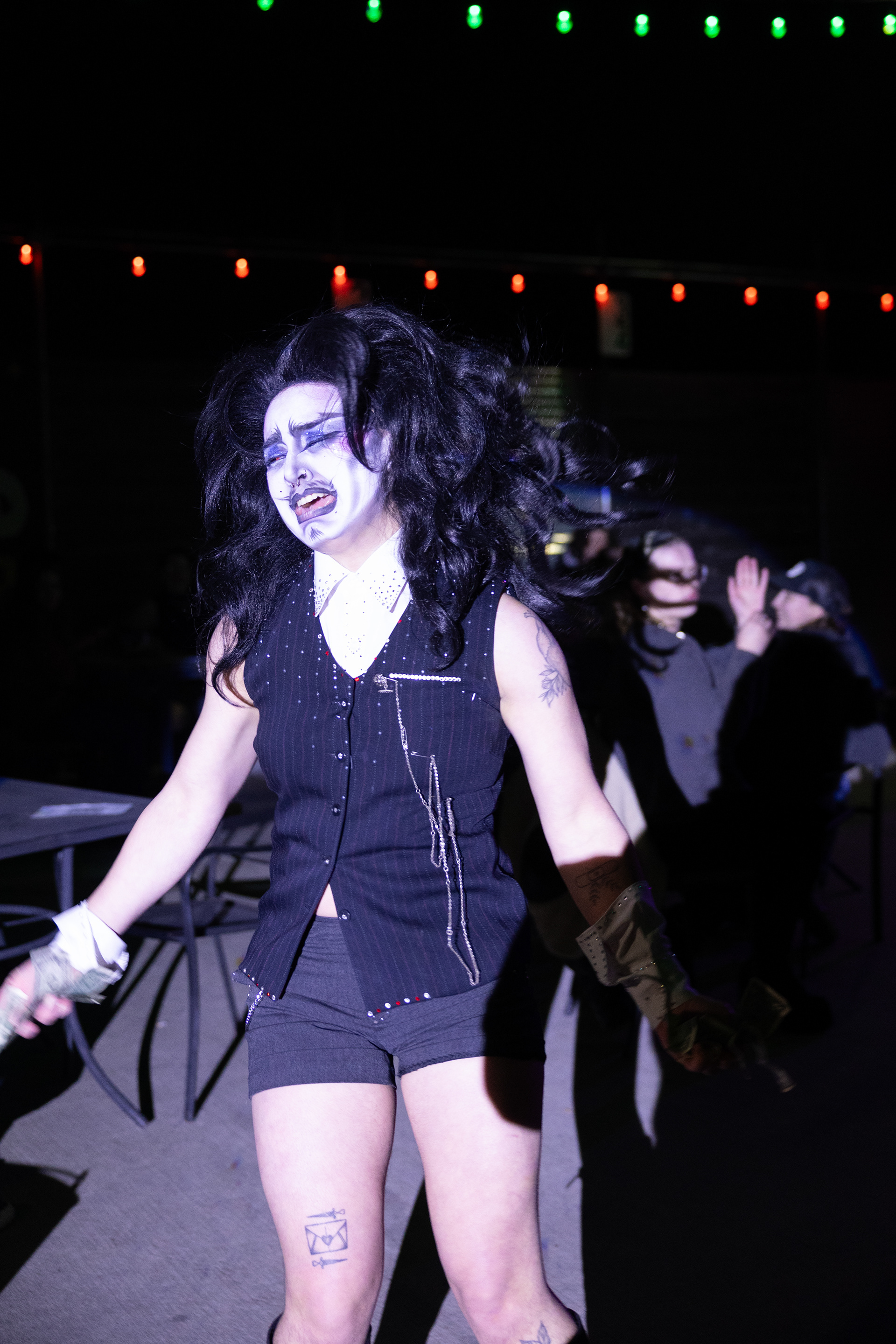 Drag King, Señor Sissa Muerta contorts their face in agony during their performance at Glitterbomb’s weekly show at Rubber Gloves Rehearsal Studio on March 6. Their performance included a scene where they “stabbed” themselves and this moment took place right before then.