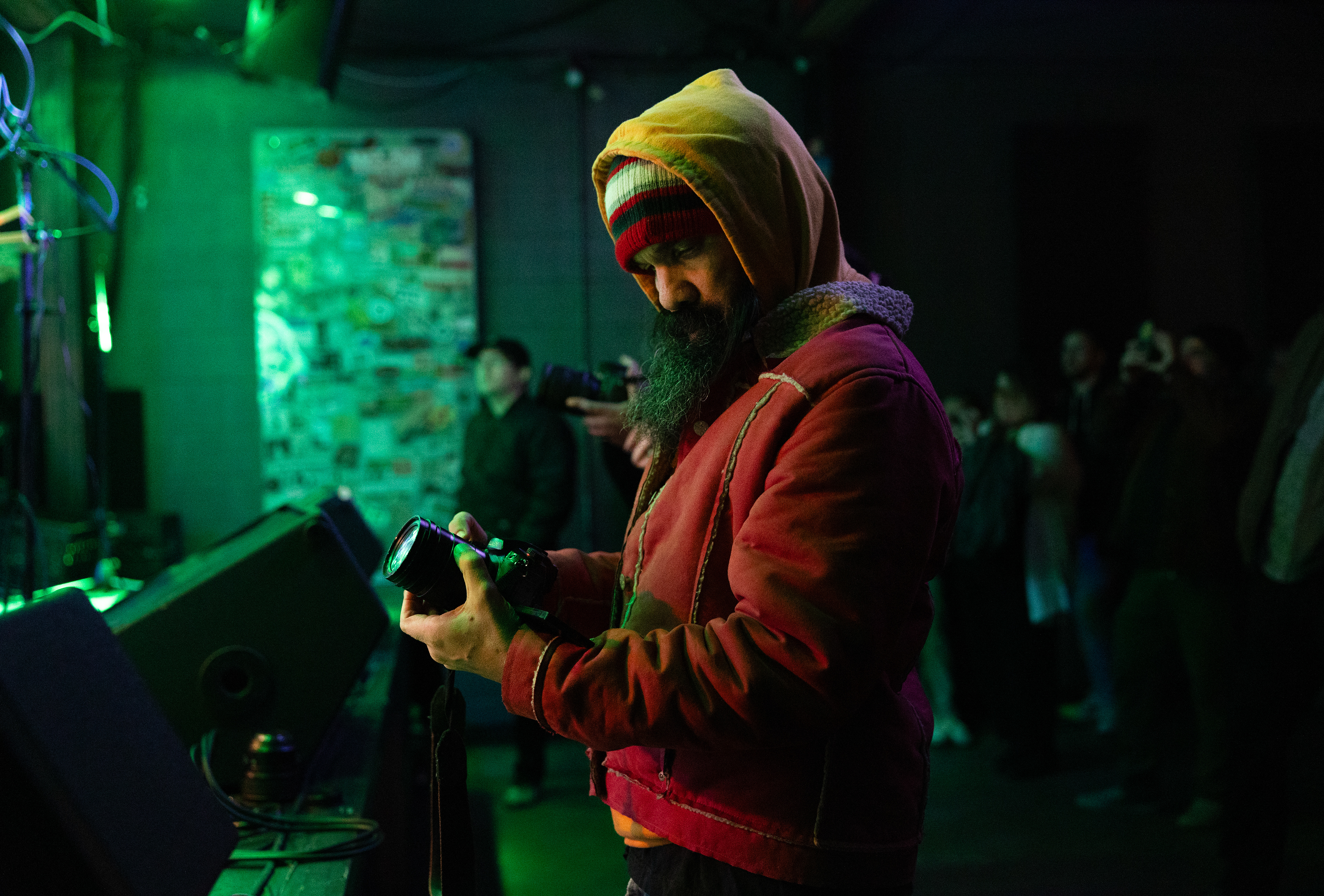 Larry Hill, a Rubber Gloves Rehearsal Studios videographer, works on recording the band Ducks Ltd. as they perform on April 5, 2025.