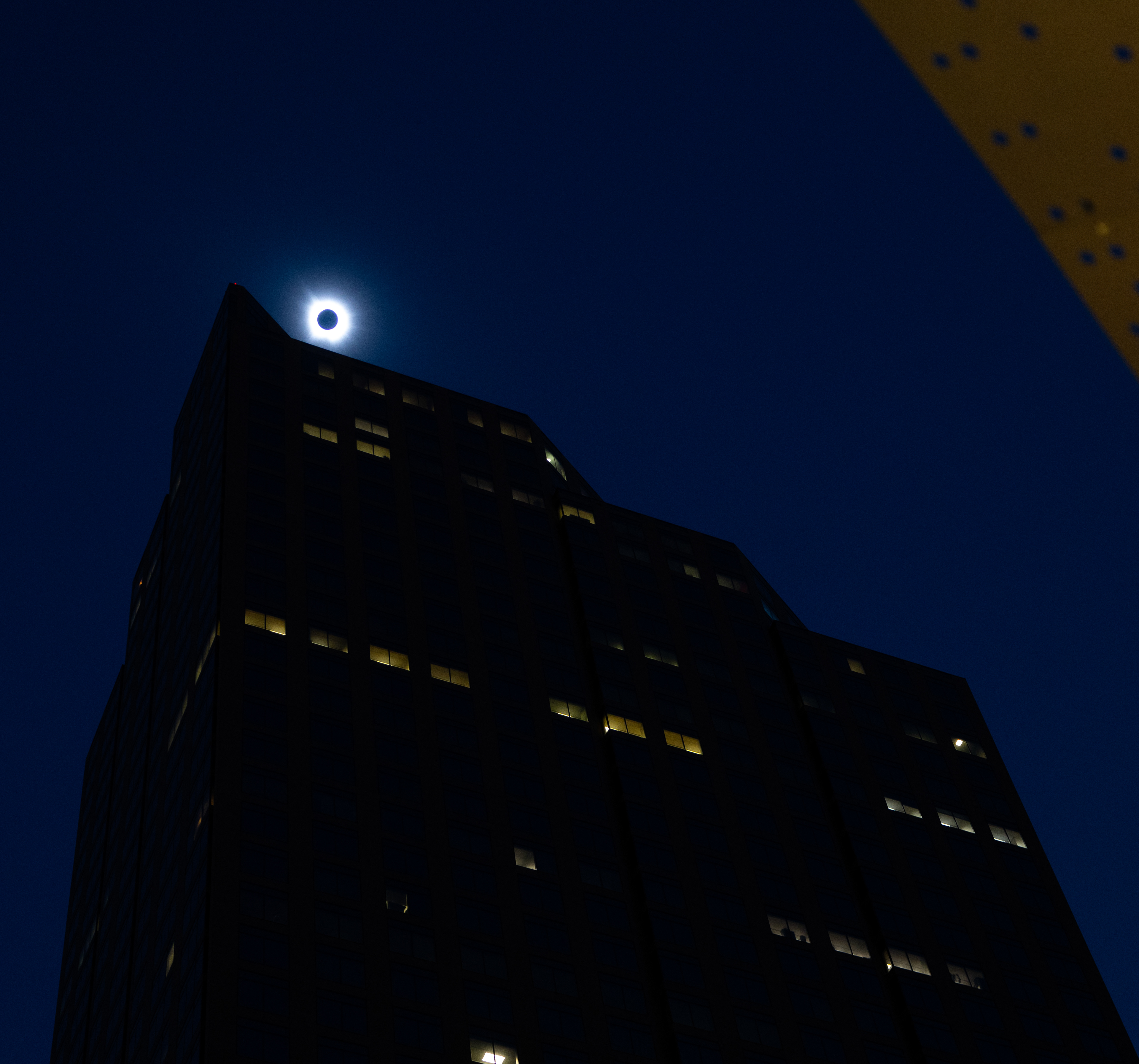 The total eclipse passes over downtown Dallas as the city is bathed in darkness.