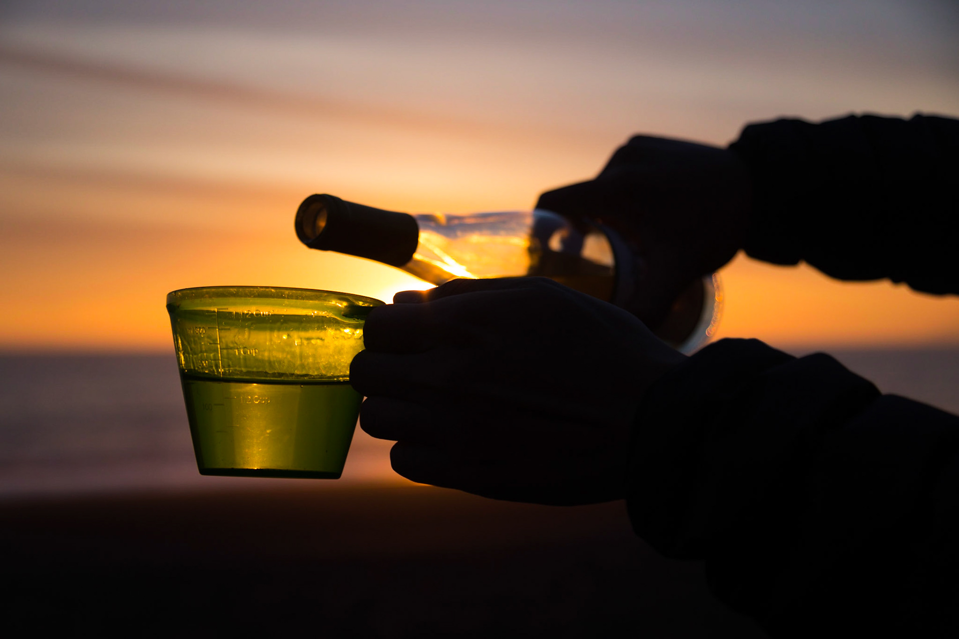 Pouring a spot of wine after a 3 day hike along the beach on the Lost Coast trail outside of Shelter Cove, CA.