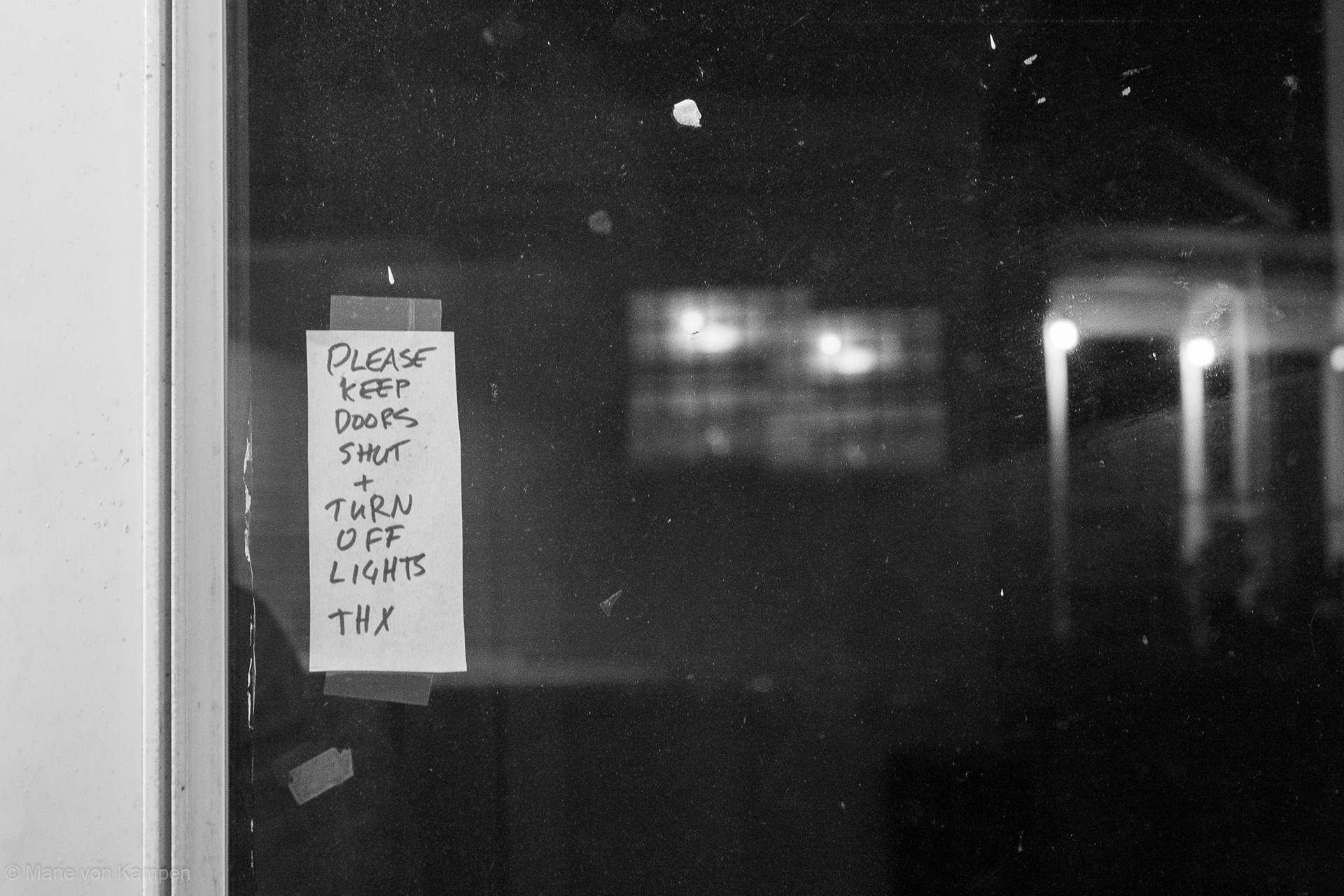 Note from the landlord and double reflection of the neighbor's porch. Taken in Brookline, MA, on Monday, November 23, 2020. f5.6 (0.4s ISO 1600) Lens: EF-S18-55mm f/3.5-5.6 IS (EFL 43mm) Photo by Marie von Kampen