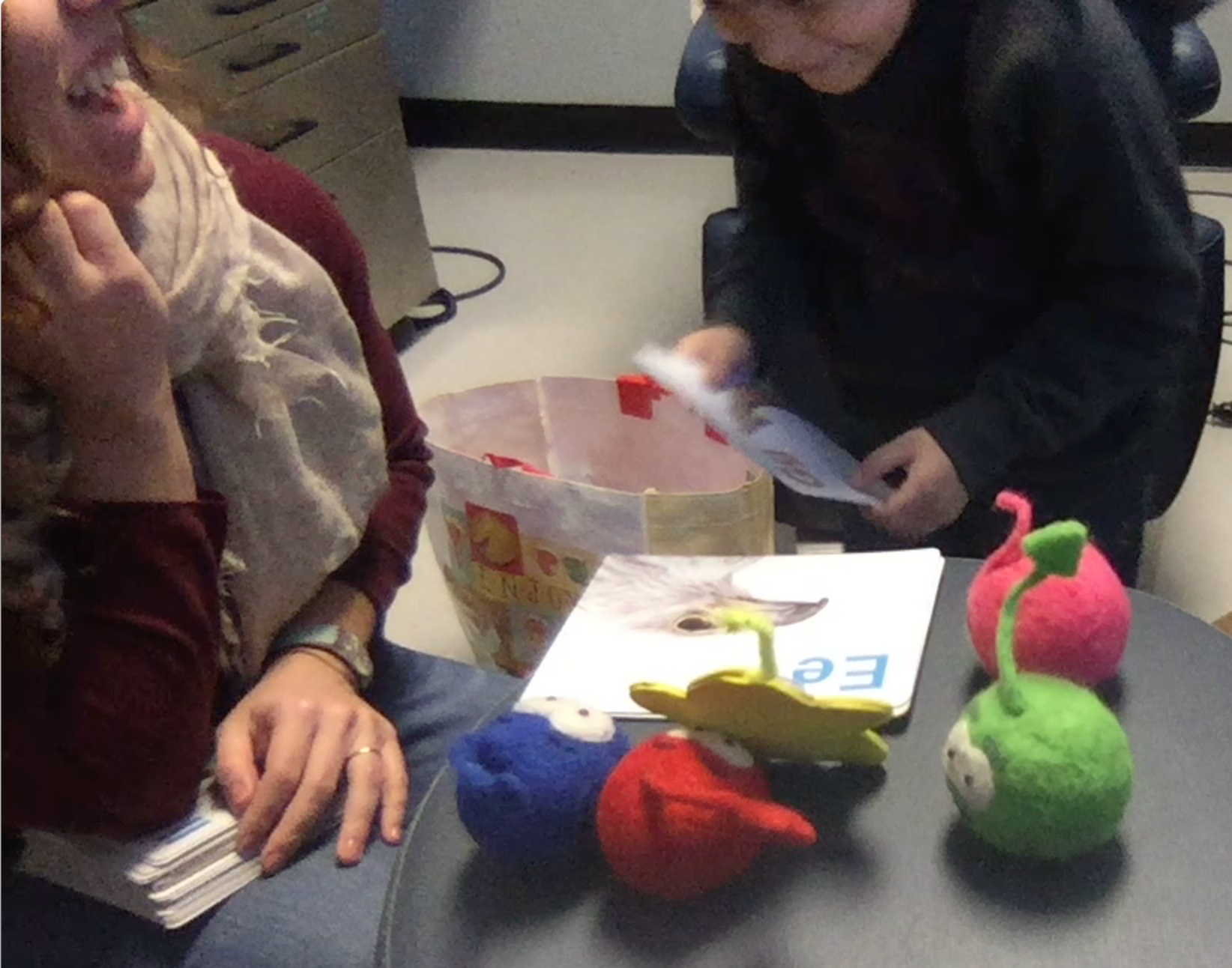 Child with a cleft playing with design probes and designing new SpokeIt games