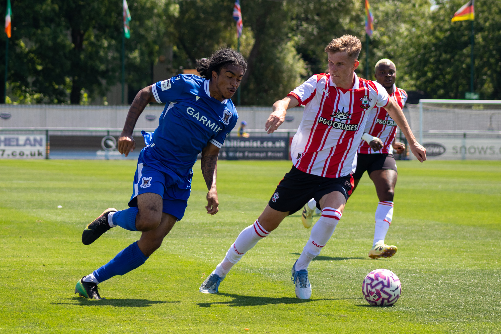 AFC Totton trialist takes on a Southampton player.