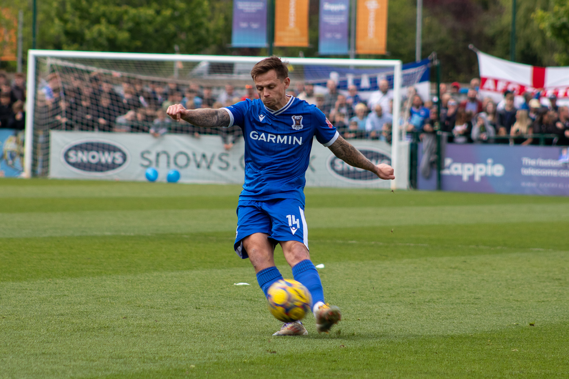 Craig Tanner passes the ball.