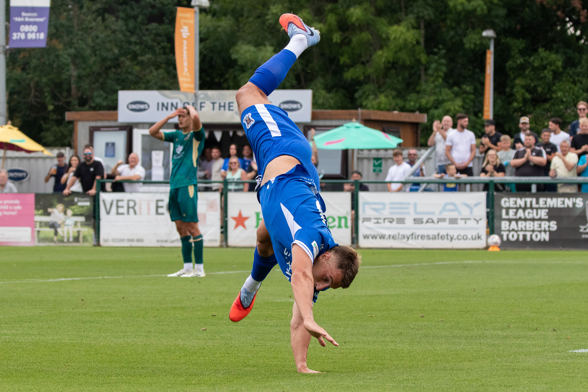 Tony Lee celebrates his goal with a cartwheel.