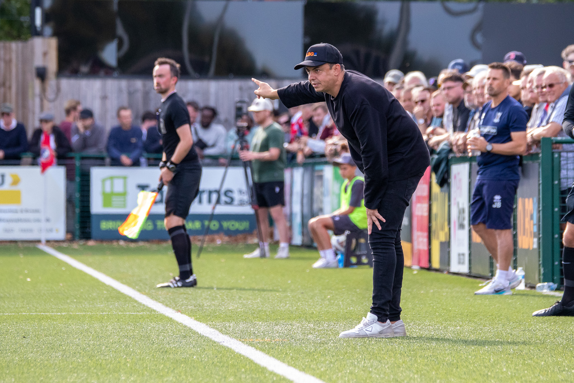 Marc White points and gives instructions to his players.