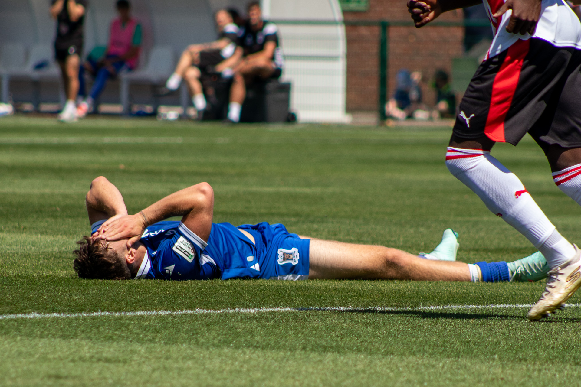 Christie Ward lays on the floor.