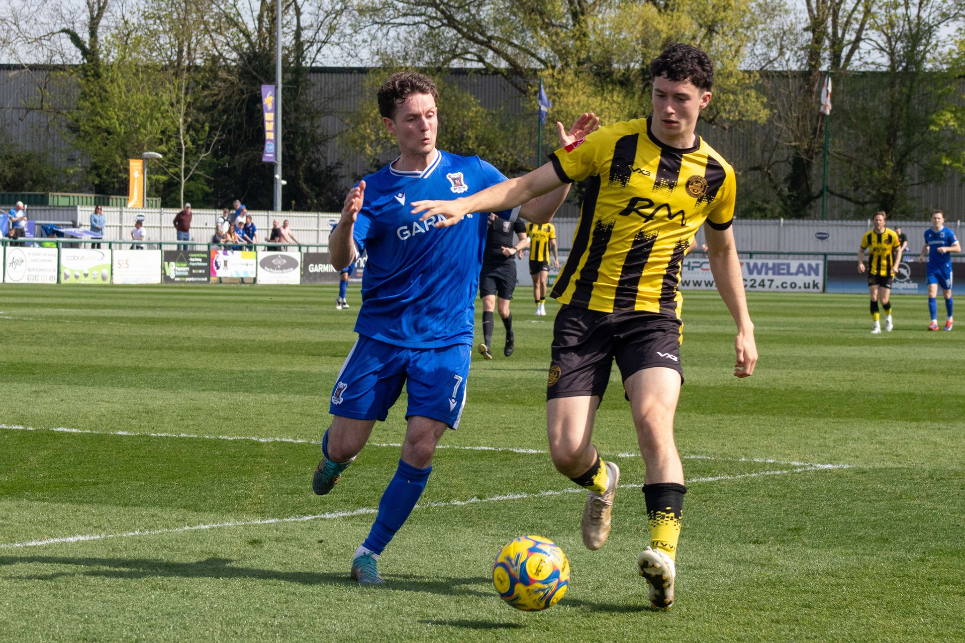 Benjamin Seymour attempts to regain possession.