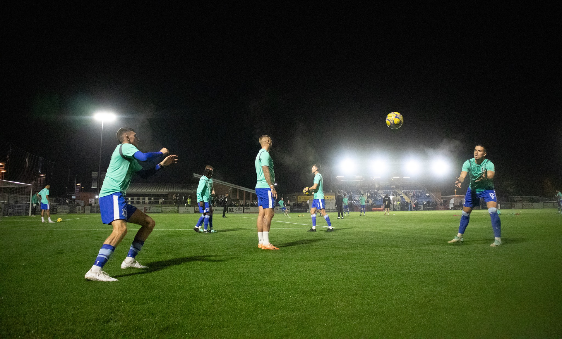 The players in their pre-match warmup.