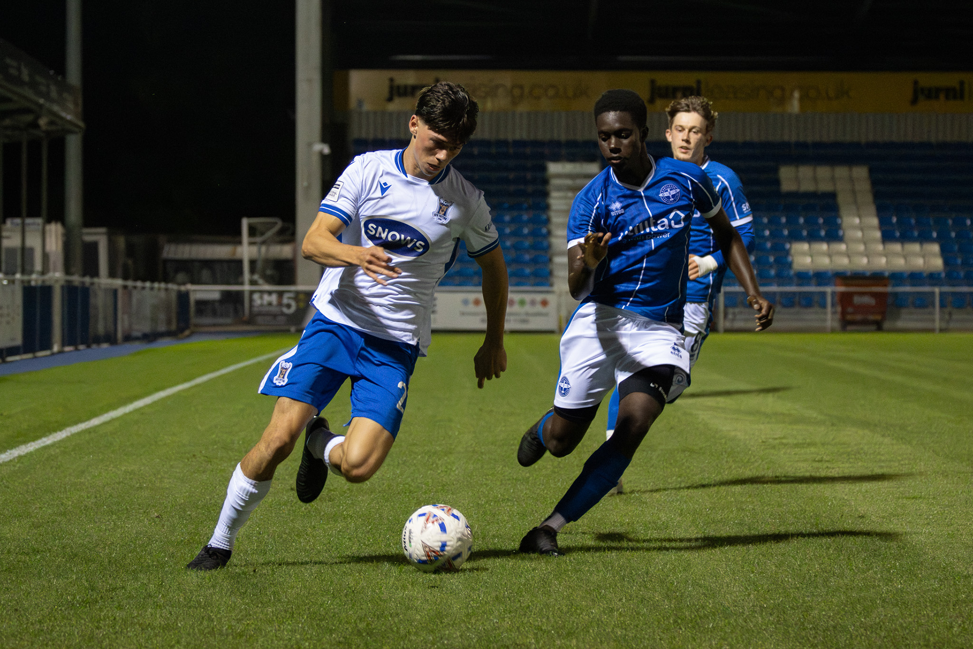 Ralph Vigrass dribbles down the wing.