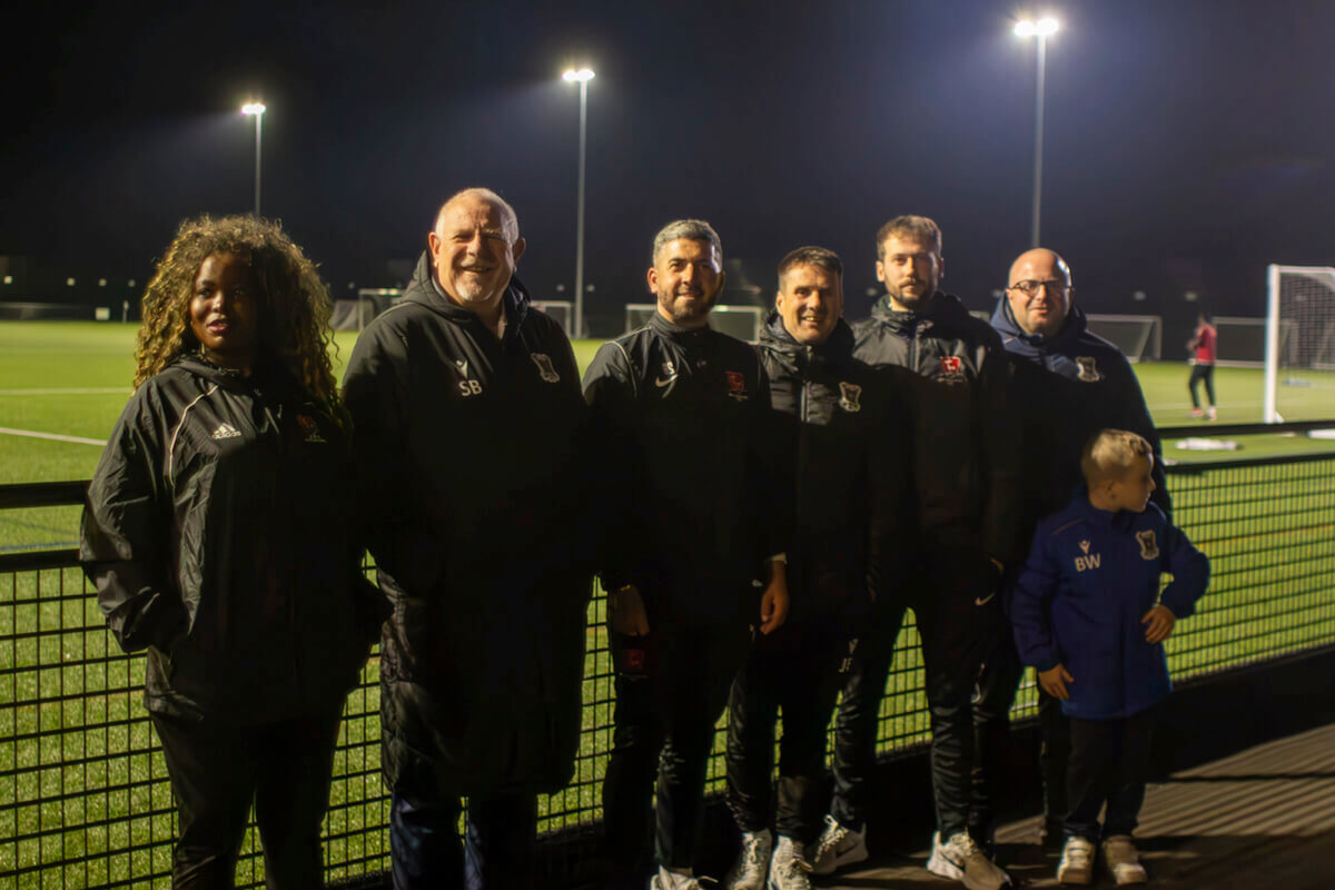 A photo of all of the representatives outside of the BRS academy pitches.