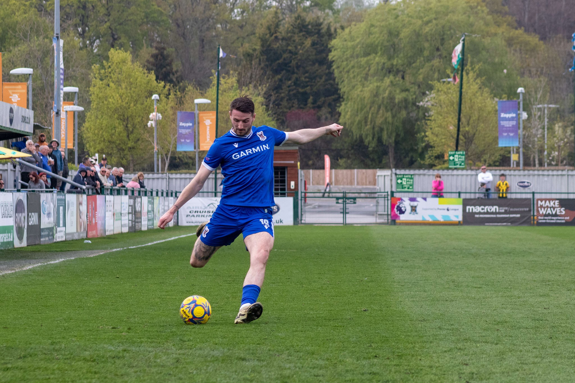 Tom Blair crosses the ball in.