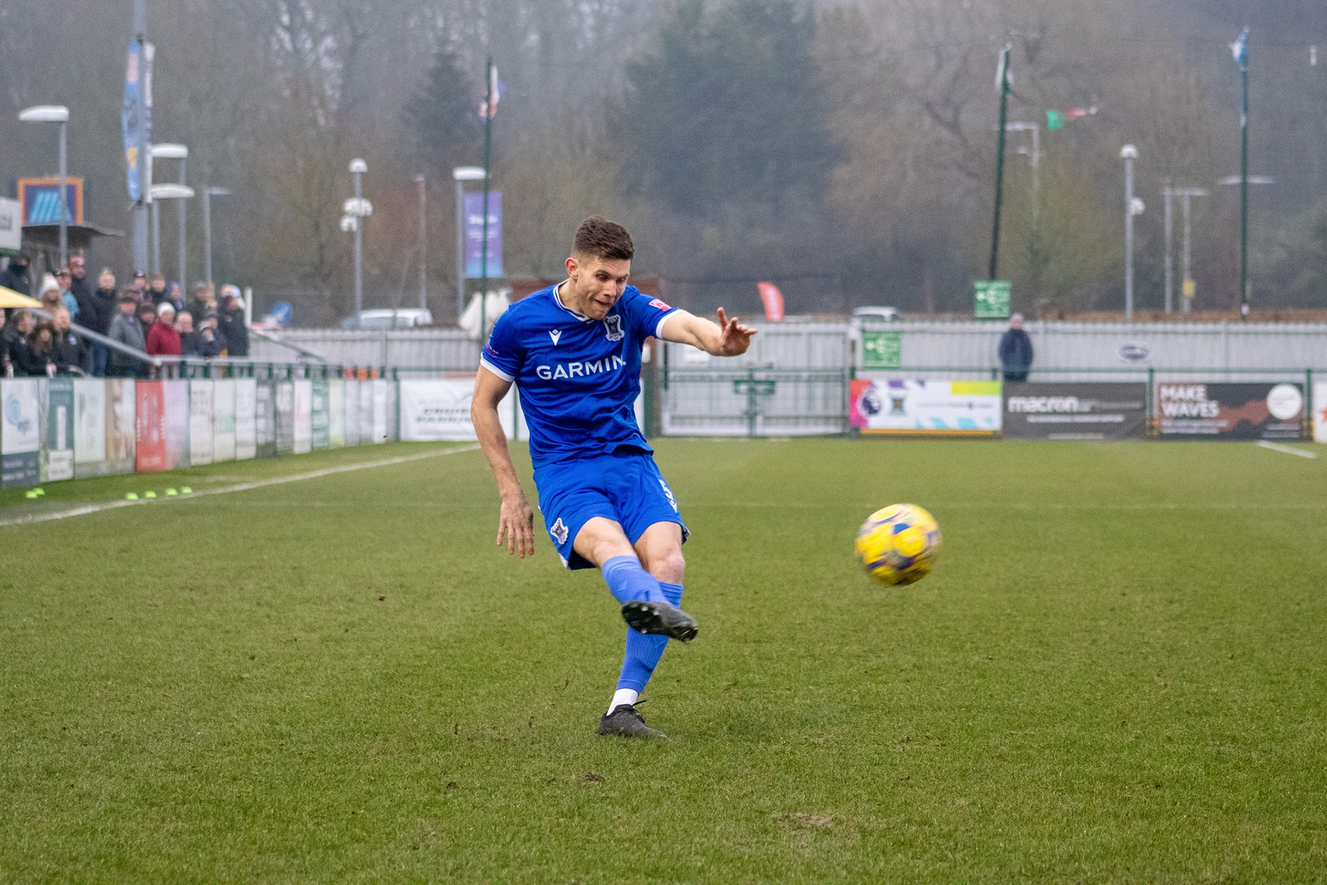 Charlie Kennedy crosses the ball.
