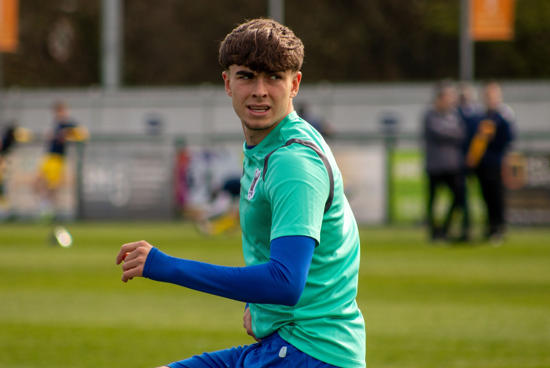 Richard McIntyre warms up pre-match.