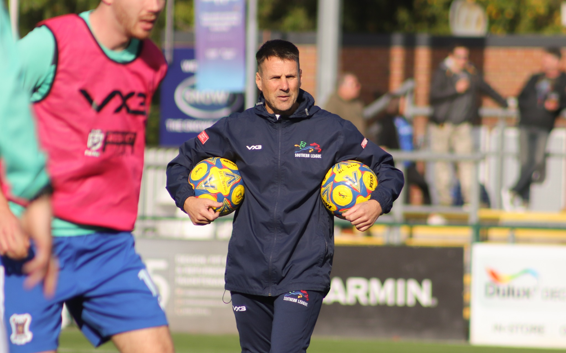 Jimmy Ball in the pre-match warmup holding two balls.
