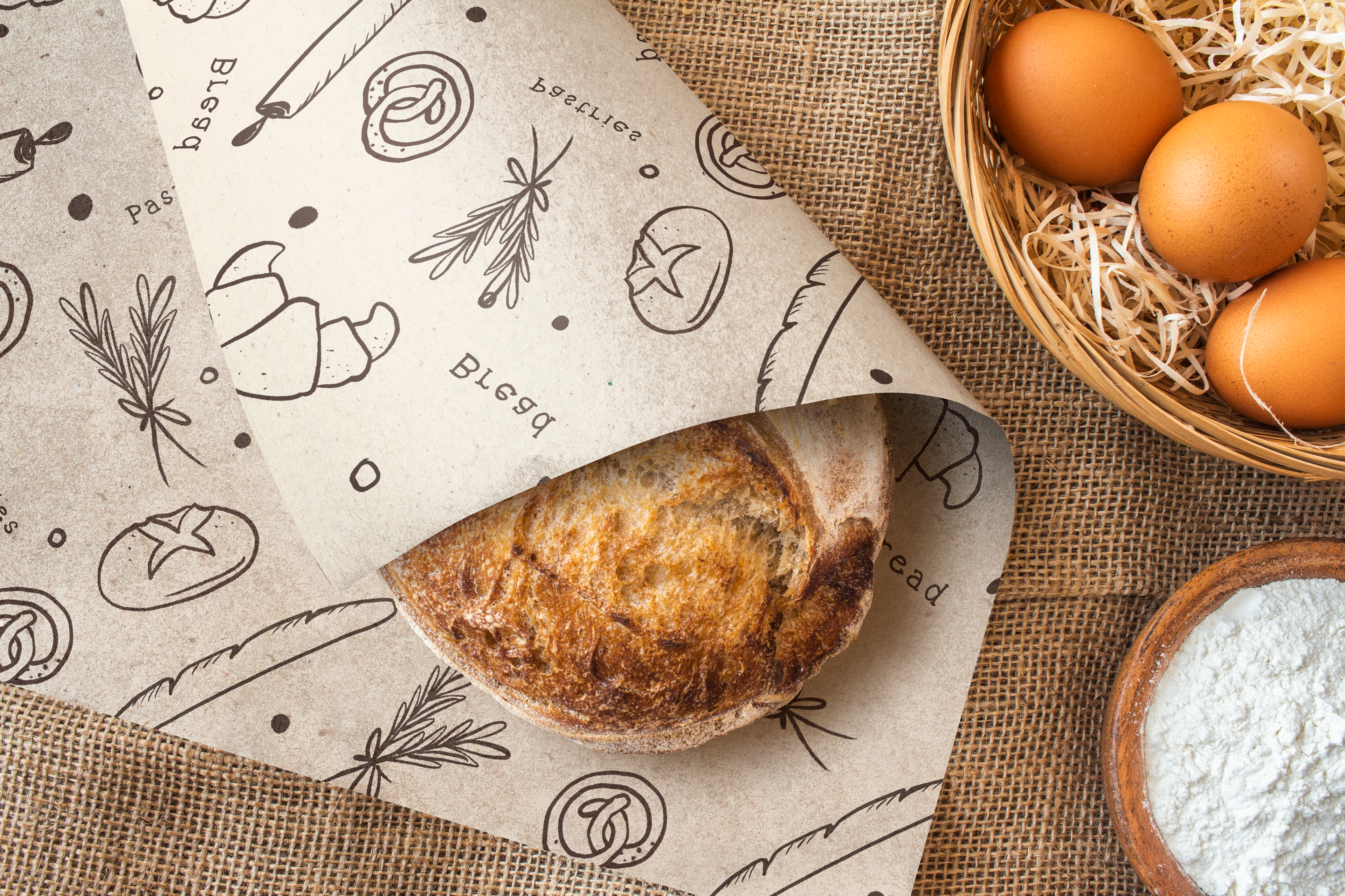 My Little Bakery pattern on wrapping paper around a sourdough loaf
