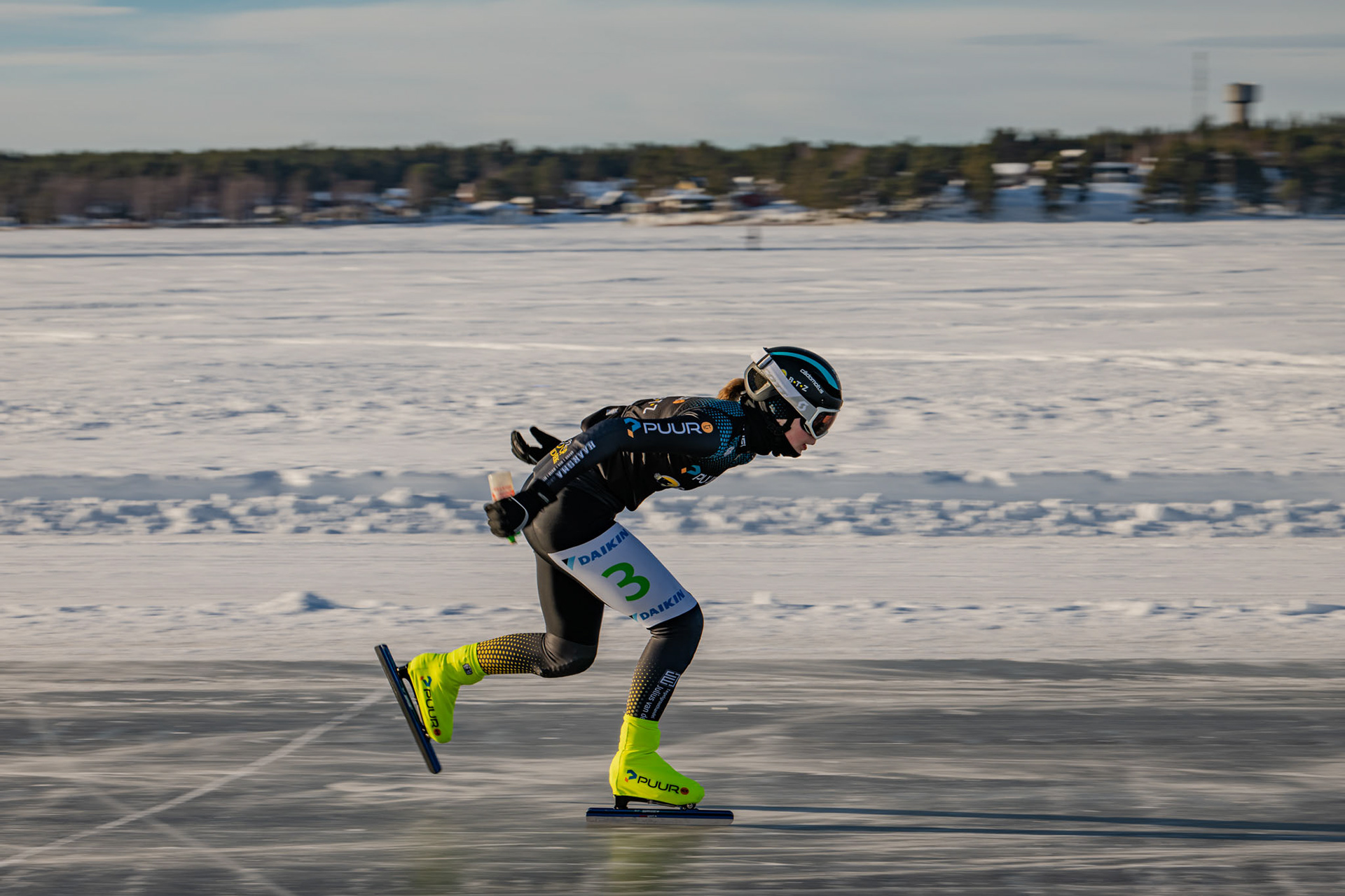 A Speed Skater cruising through ice at the Frozen Sea at Lulea, Sweden.