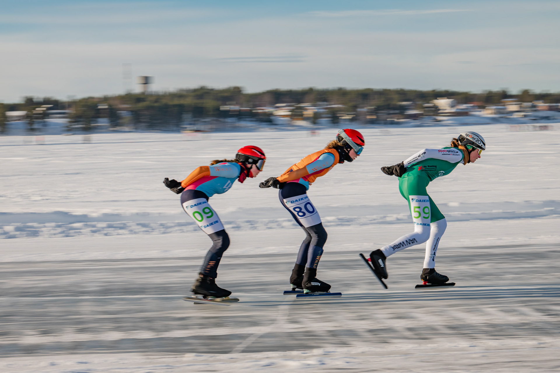 Contestants cruising through ice at the Frozen Sea at Lulea, Sweden for Schaatsen Luleå