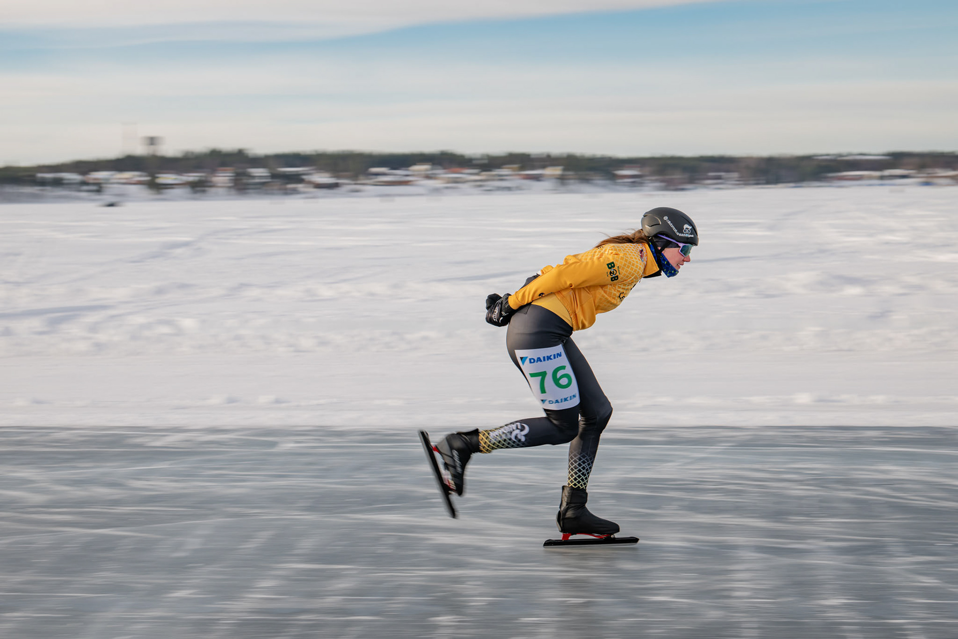A Speed Skater cruising through ice at the Frozen Sea at Lulea, Sweden.