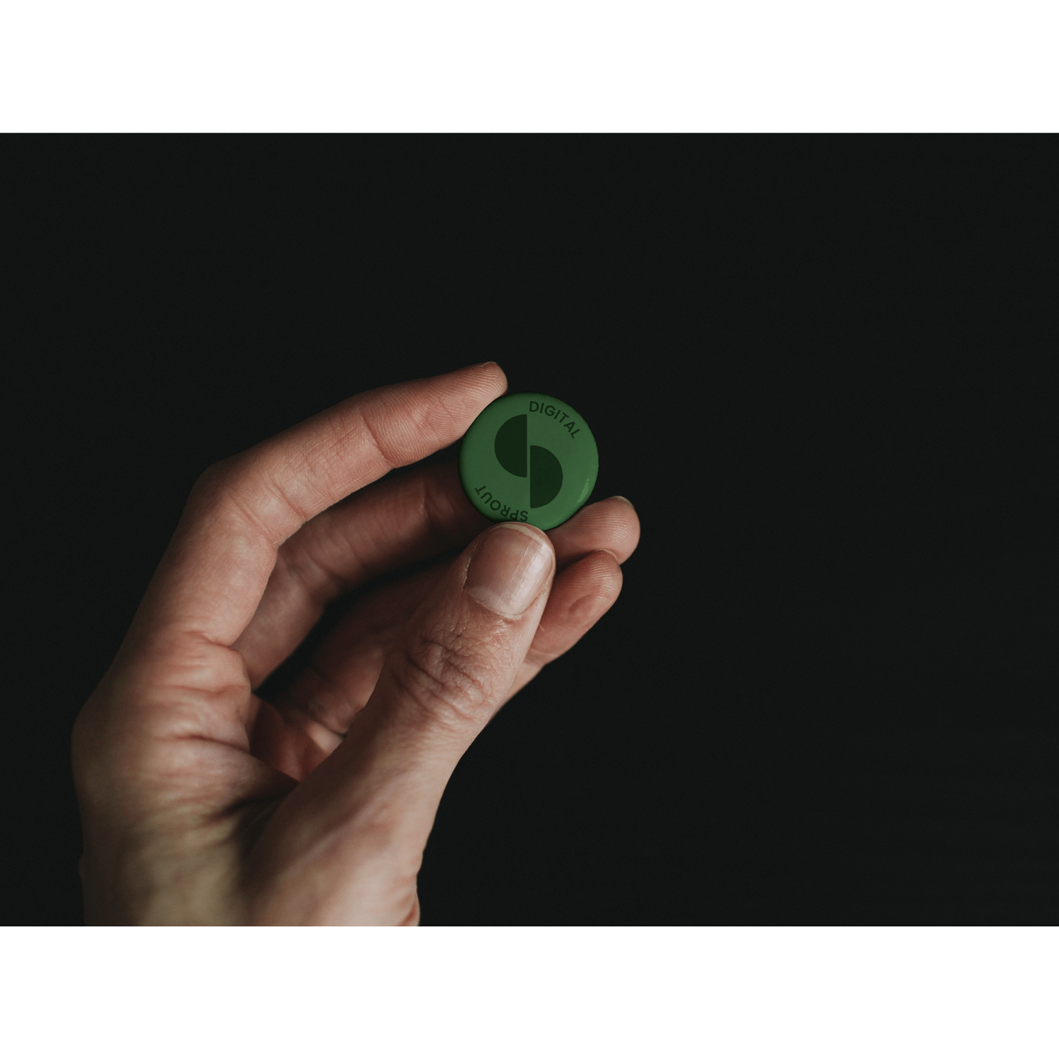 A branded pin for a digital agency