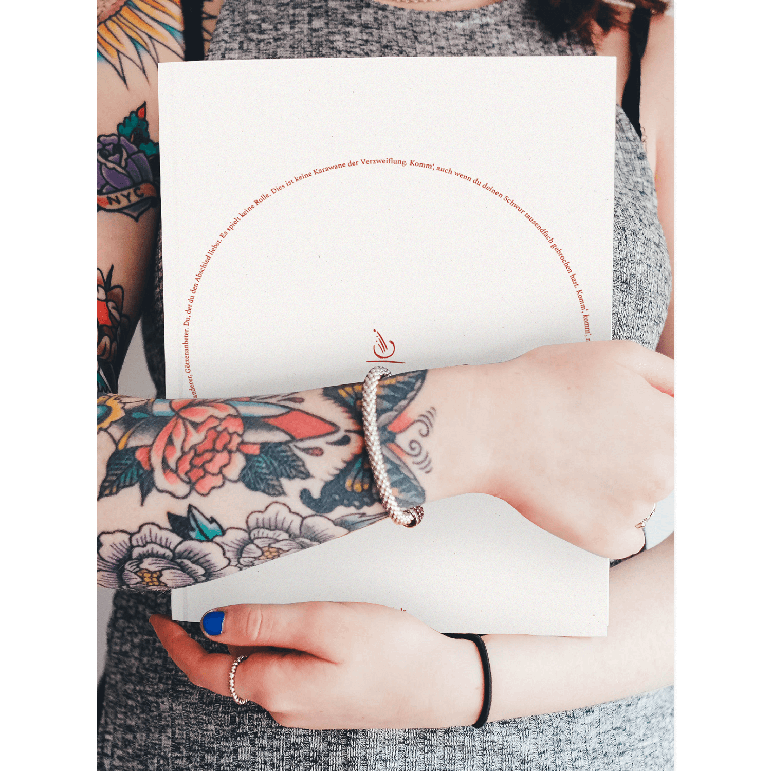 A woman holding a magazine for a midwives' association