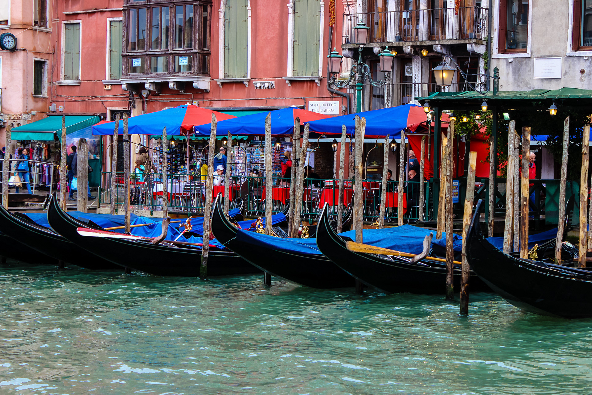 Gondolas parked along the Grand Canal - Venice, Italy