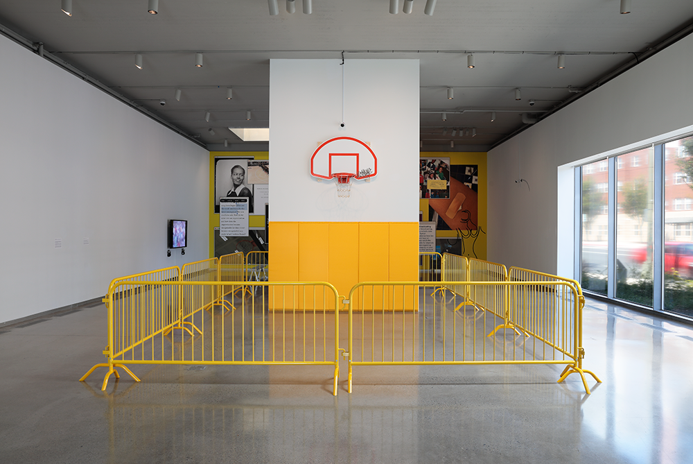 A steel fan-shaped backboard, steel rim, two-toned steel net, tobacco chew, activated charcoal, coffee grounds, gym wall padding, CCTV camera, steel barricades.